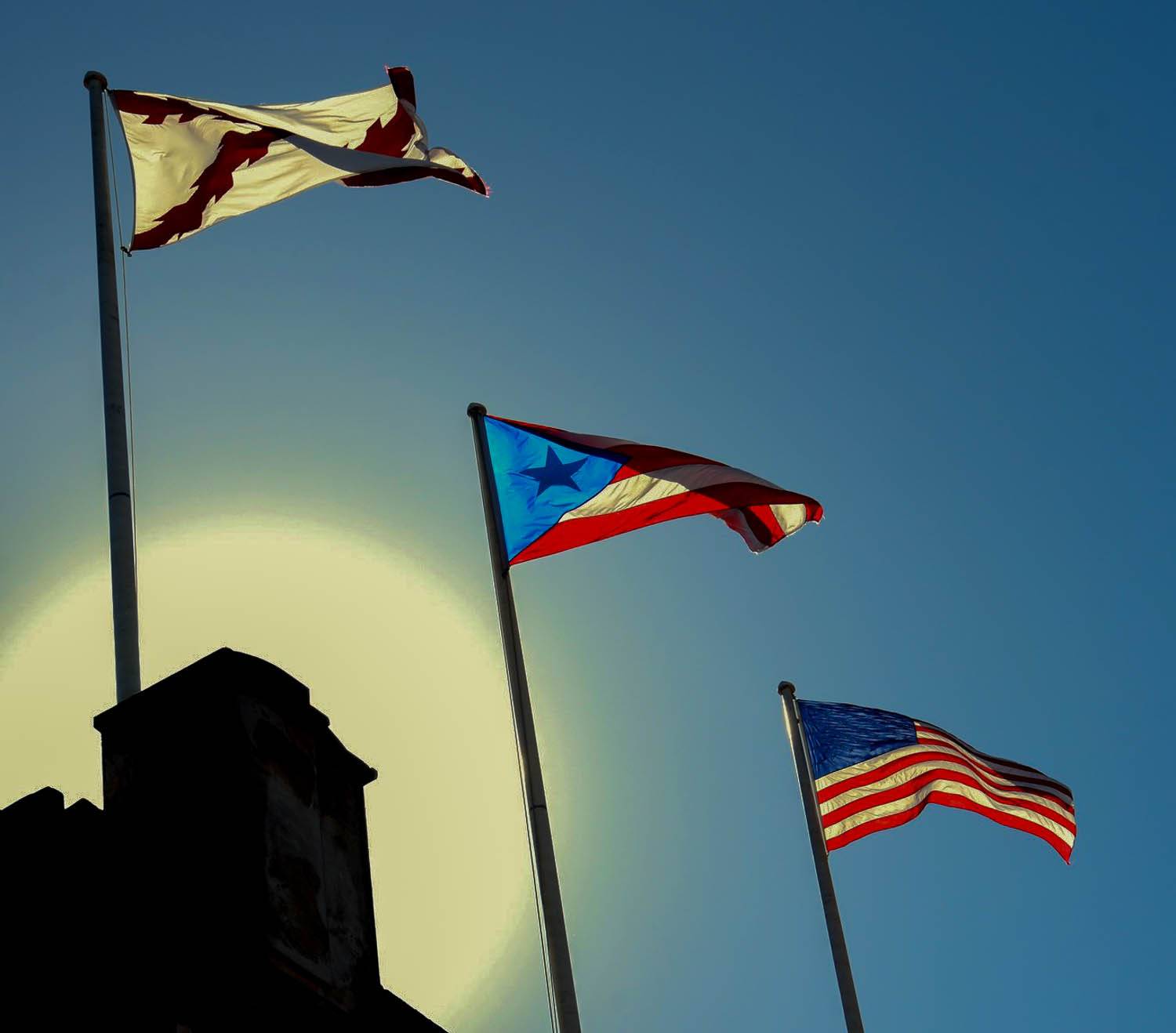 Flags flying above Castillo San Cristóbal fortress towers (Old San Juan, Puerto Rico)
