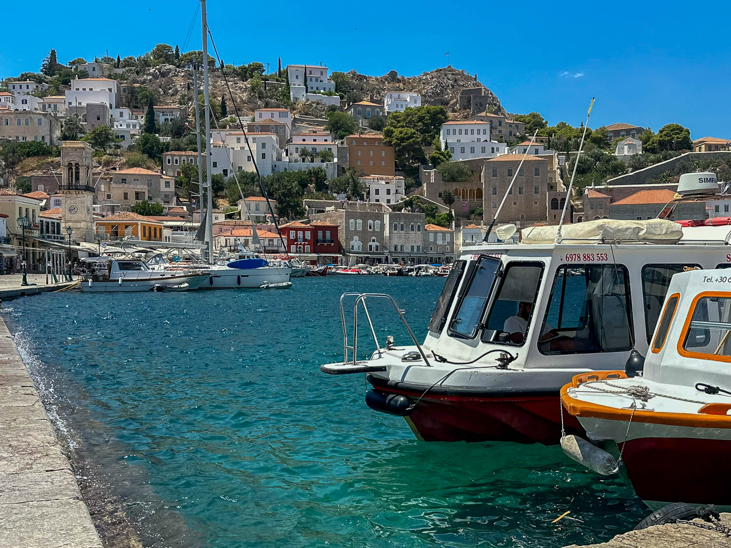 Consider taking a boat tour to see more of Hydra Island.