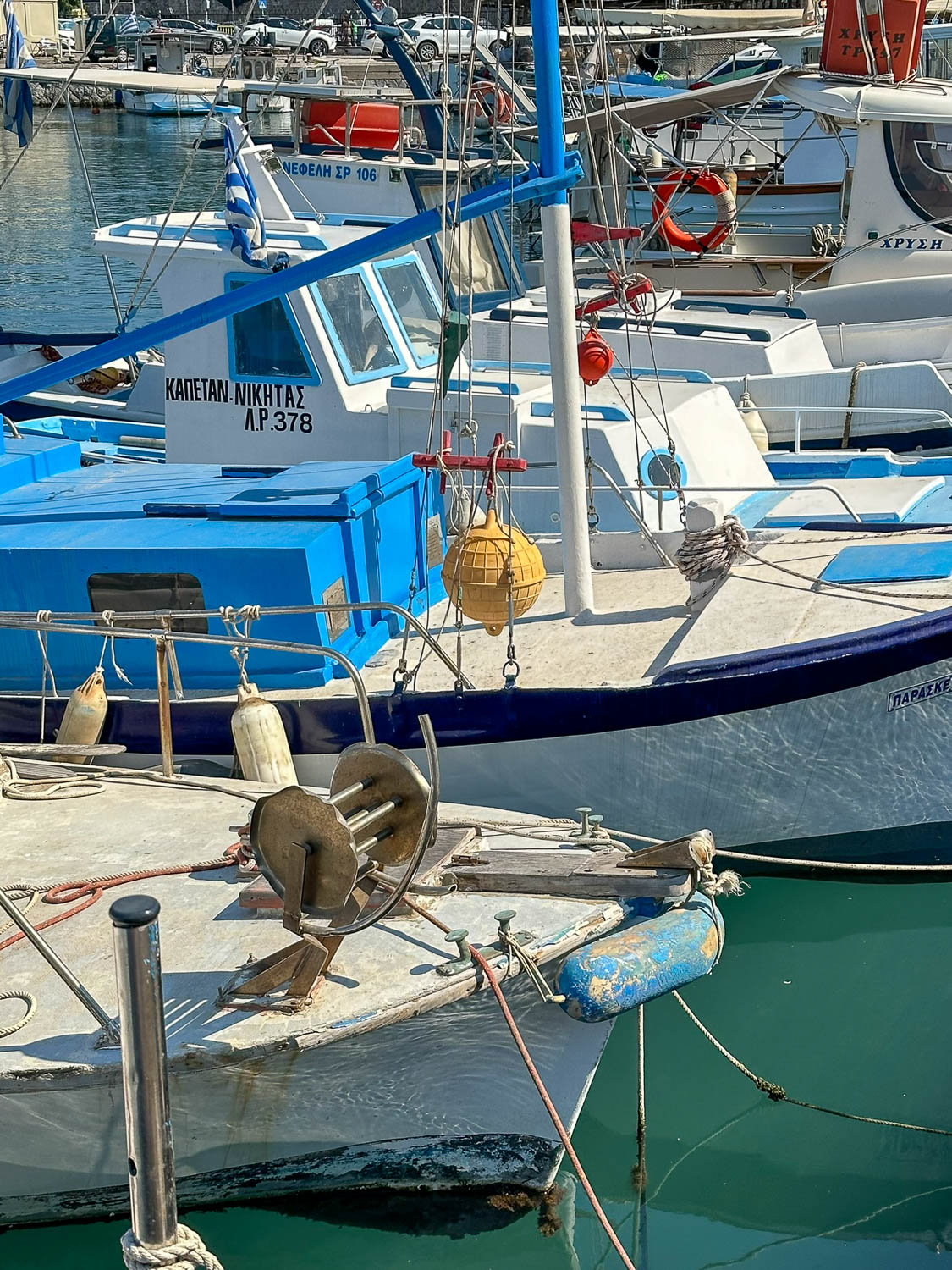 Fishing boats line Kolona Harbor Rhodes, Greece