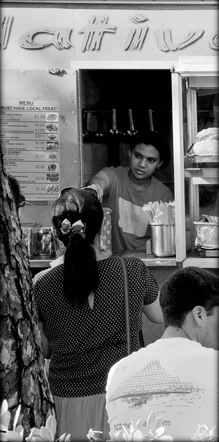 Local street food vendors in historic plaza (Old San Juan, Puerto Rico)