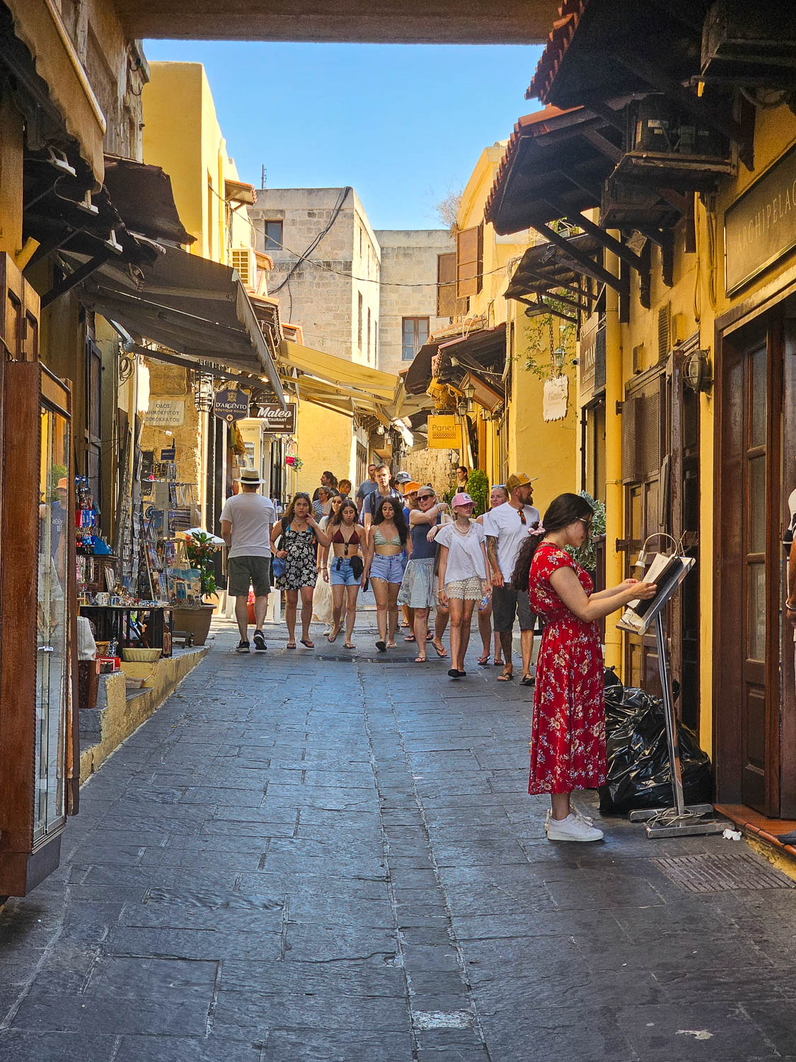 Perusing menus in the Old Town Rhodes, Greece