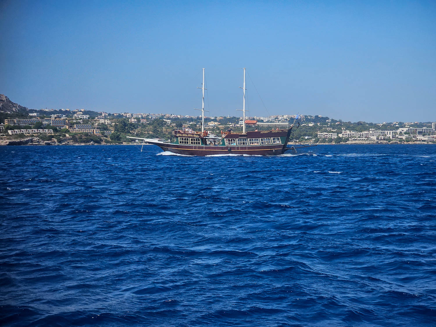 Take a tour around the island on a traditional wooden boat Rhodes, Greece