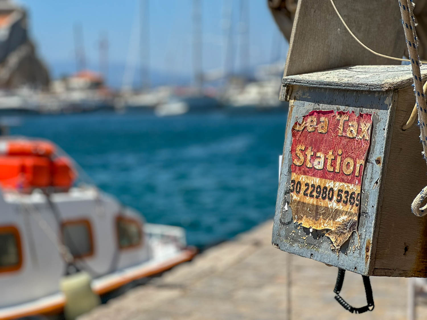 Take a water taxi from Hydra harbor to its sandy beaches