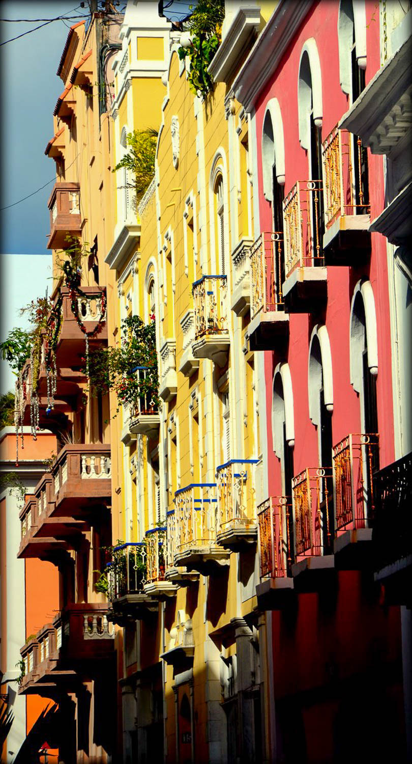 Colorful colonial buildings lining a cobblestone street in Old San Juan (Puerto Rico)