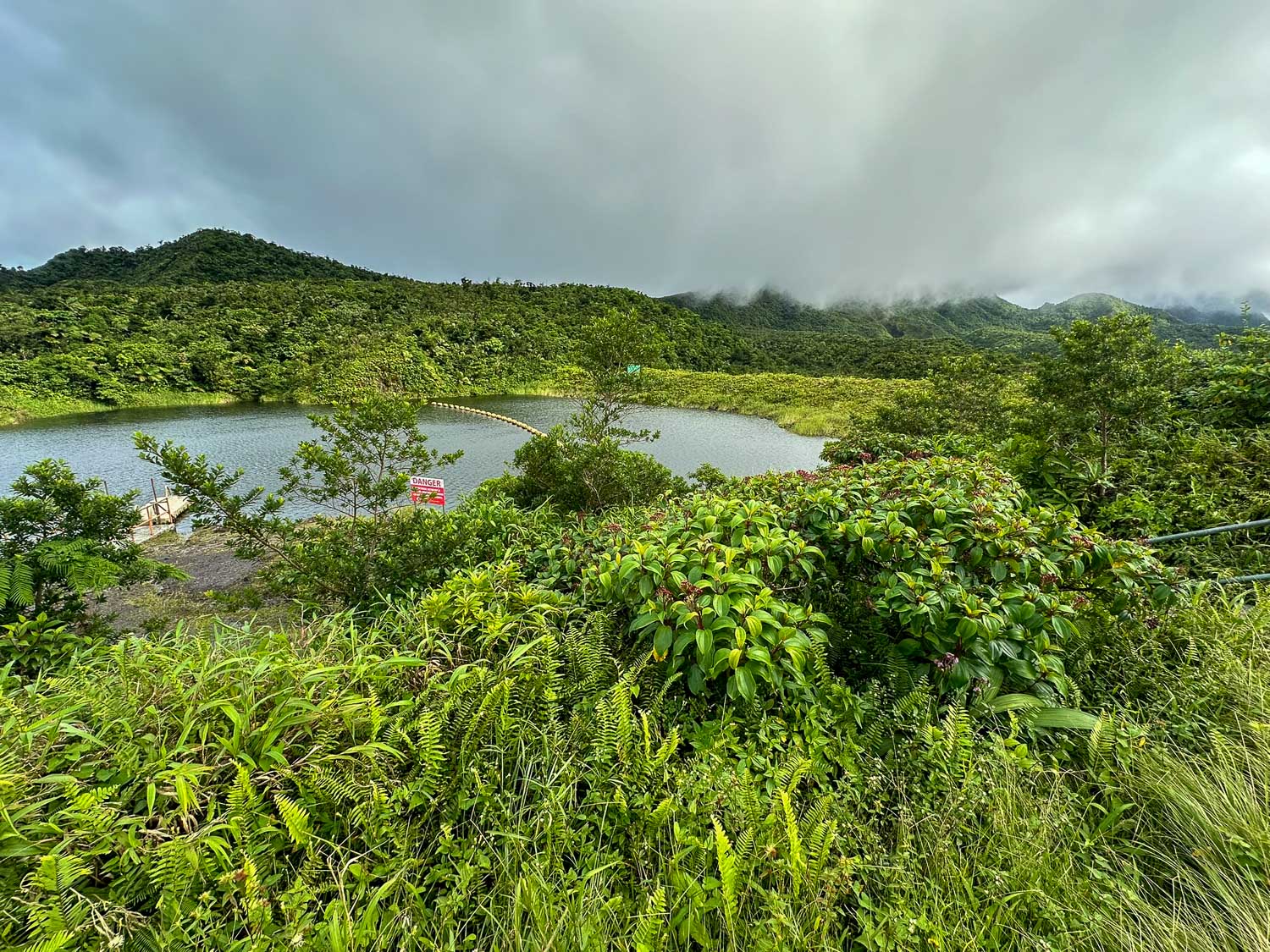 Scenic view of Freshwater Lake surrounded by mountains inside Morne Trois Pitons National Park, Dominica