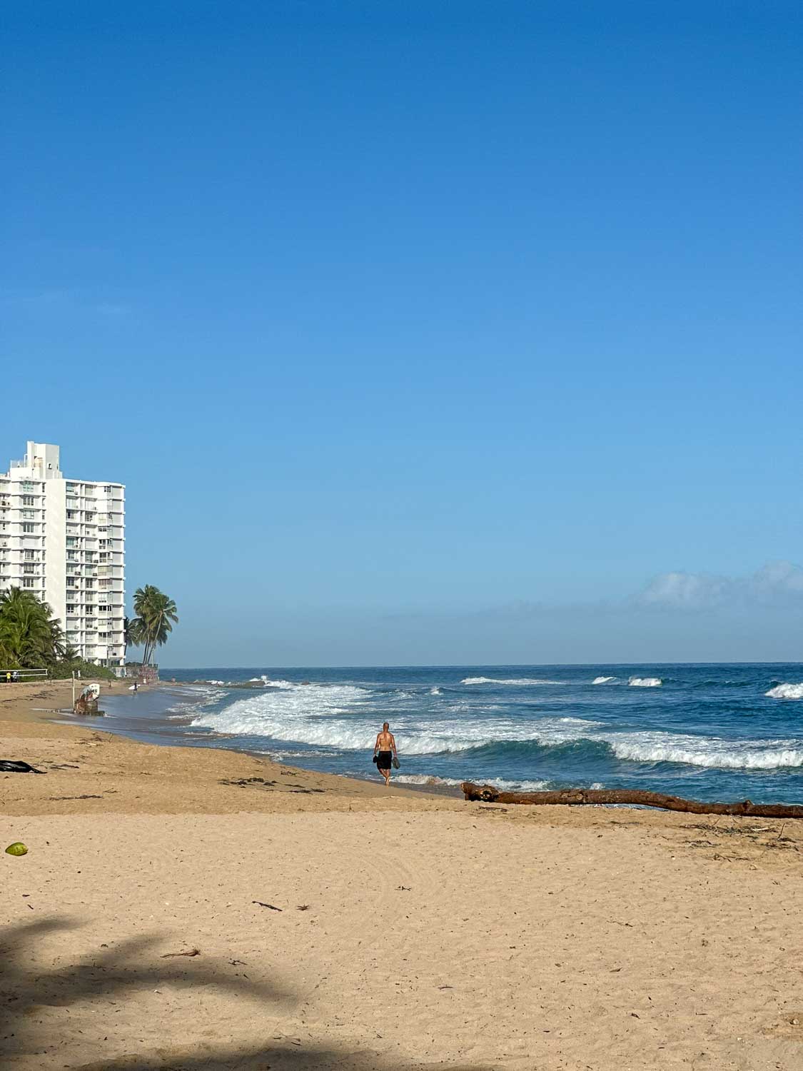 View of Condado Beach with high-rise resorts and Atlantic shoreline in San Juan, Puerto Rico.