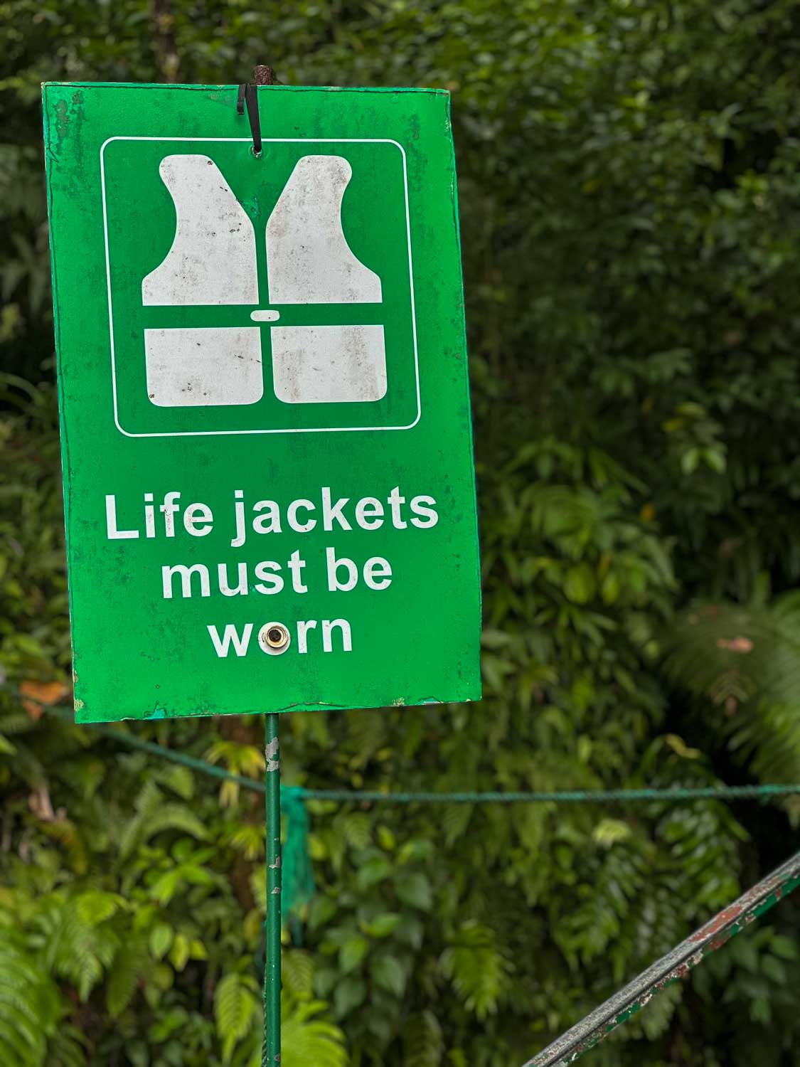 Visitors swimming through Titou Gorge wearing required life vests