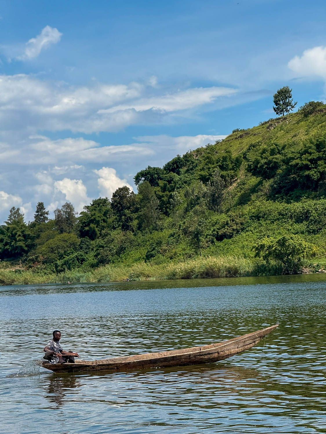 Lake Kivu, Rwanda: Top Things To Do and Travel Guide 18 Local boatsman navigating Lake Kivu