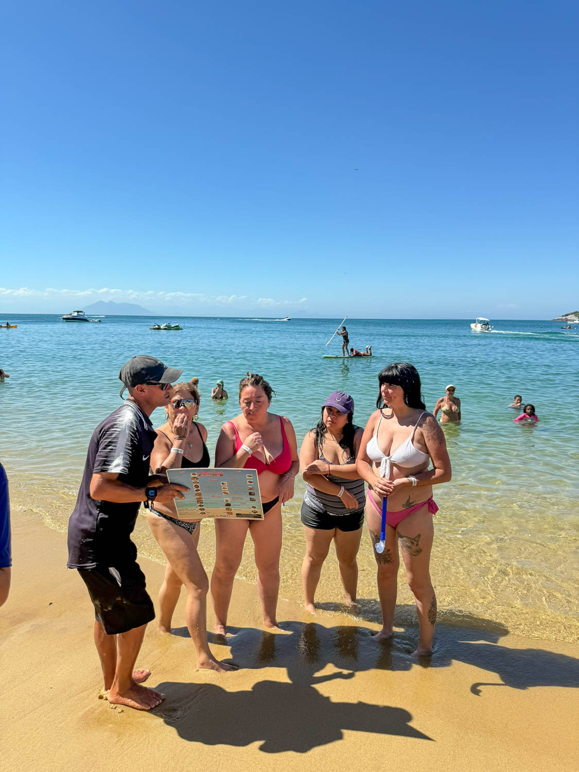 Buzios, Brazil Travel Guide: Best Things To See and Do 13 Local bartender serving beach visitors at Praia João Fernandes in Buzios, Brazil