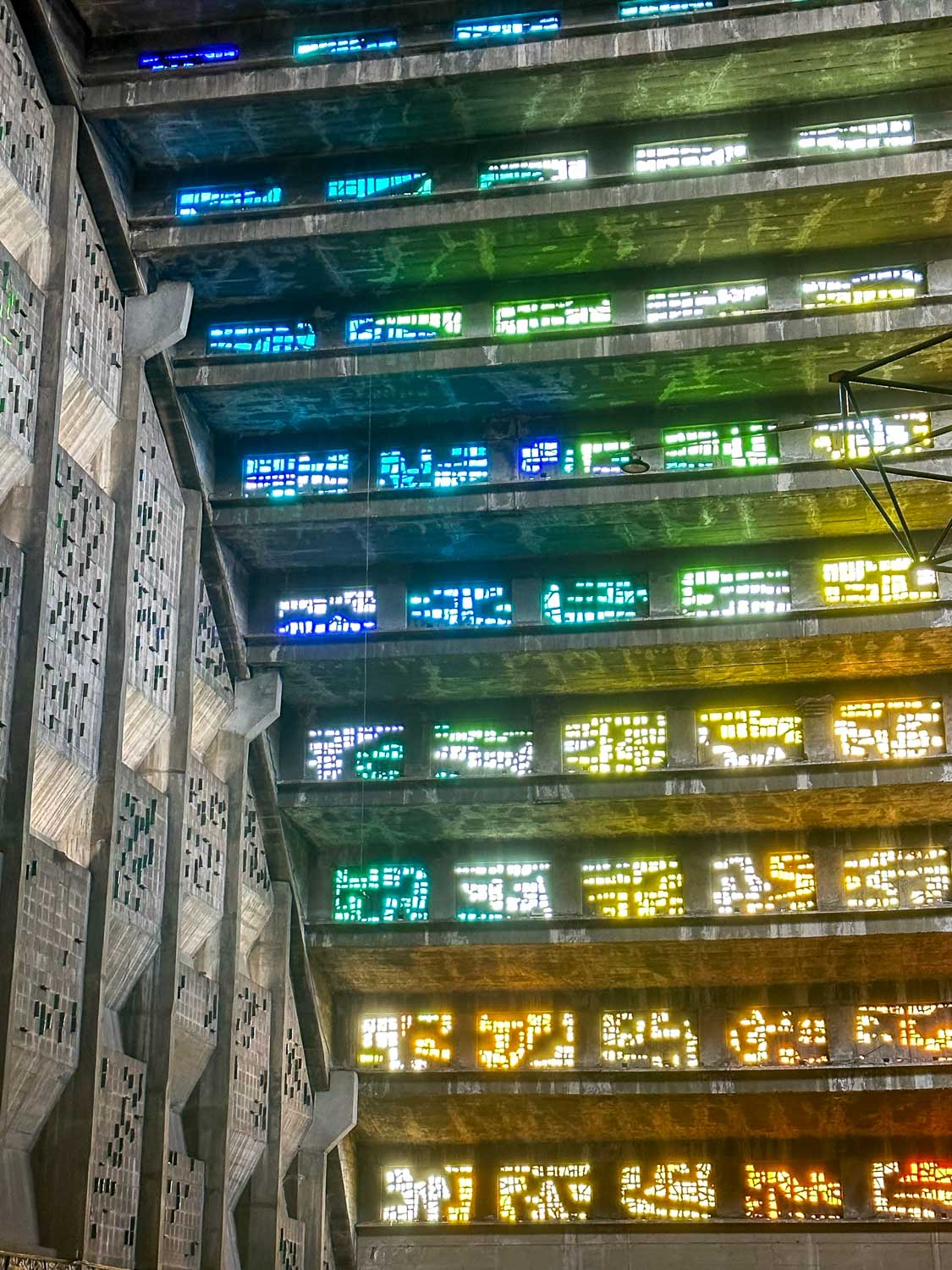 Interior of Iglesia El Rosario with colorful stained glass in San Salvador