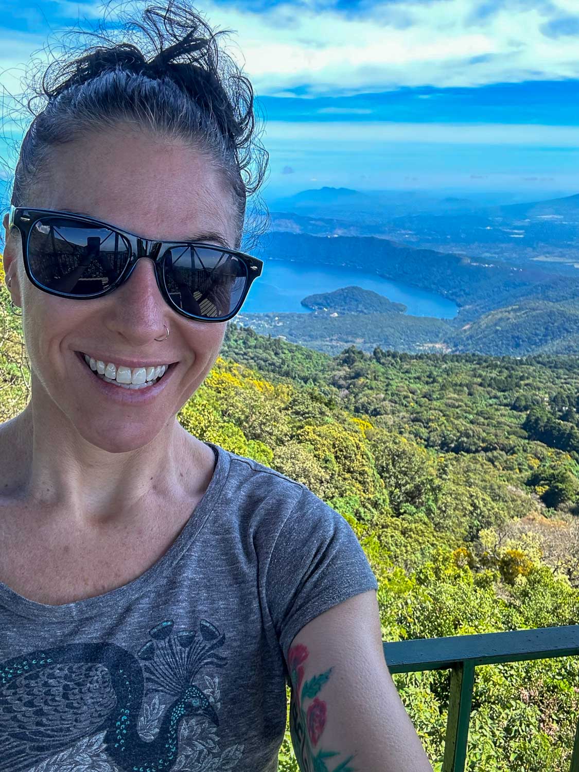 Blue crater lake surrounded by hills at Lago de Coatepeque in El Salvador