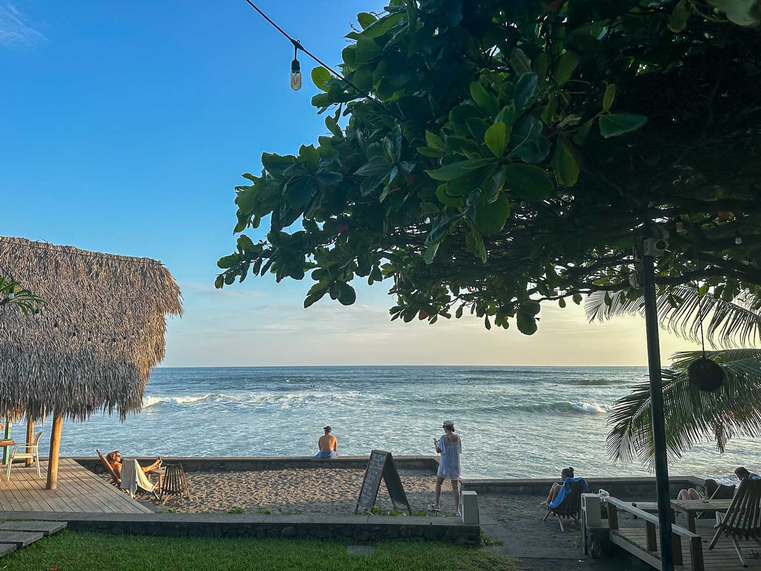 Surfers riding Pacific Ocean waves along El Salvador’s coast