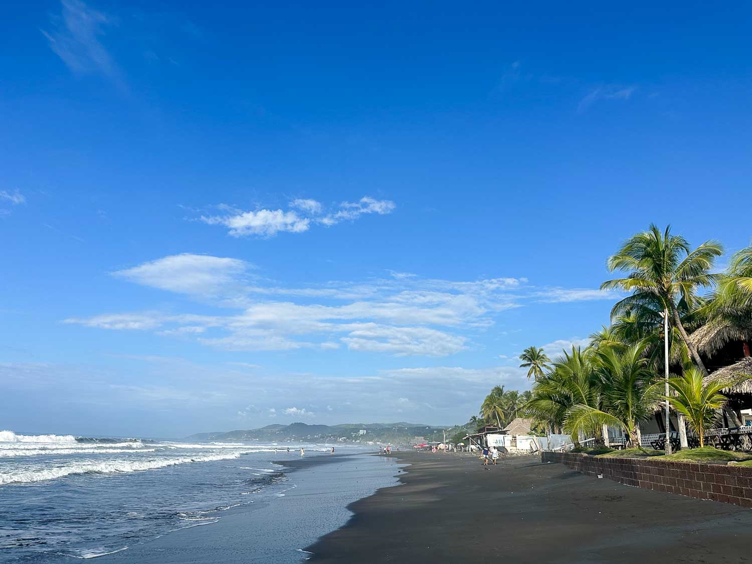 Sandy beach and Pacific Ocean coastline at Playa El Majahual in El Salvador