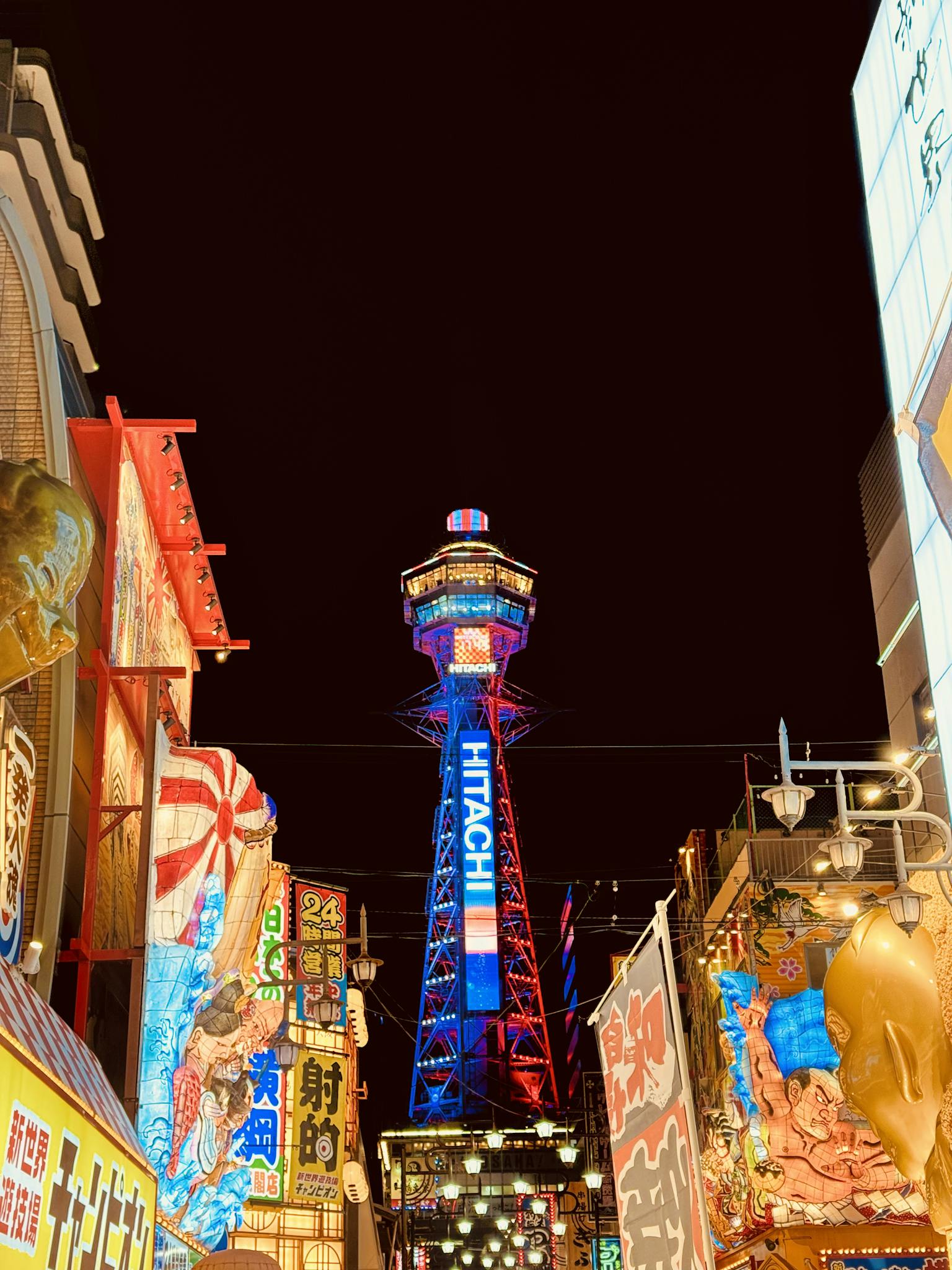colorful night view of tsutenkaku tower in