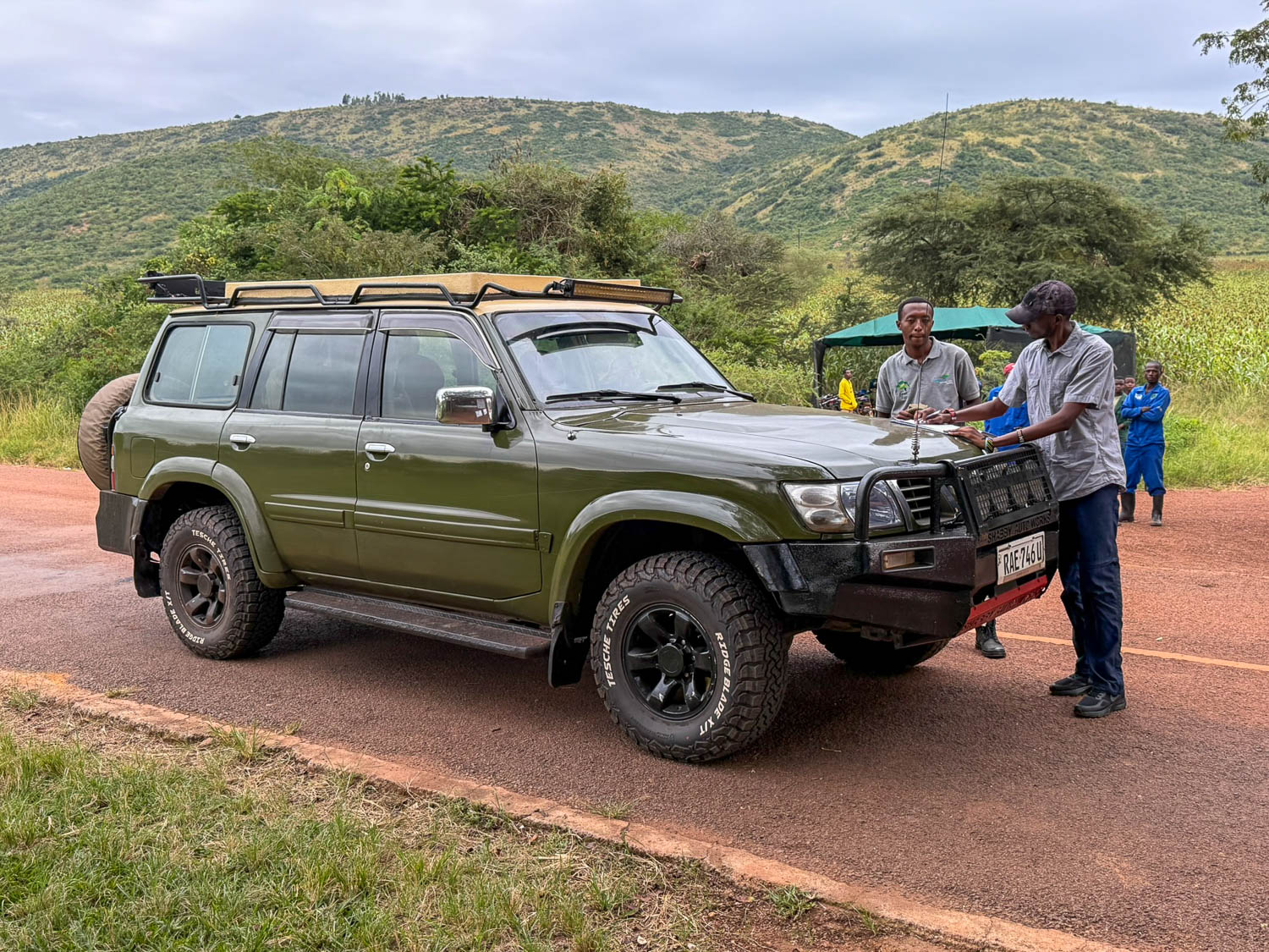 Safari guide checking visitors in near the southern gate of Akagera National Park, Rwanda