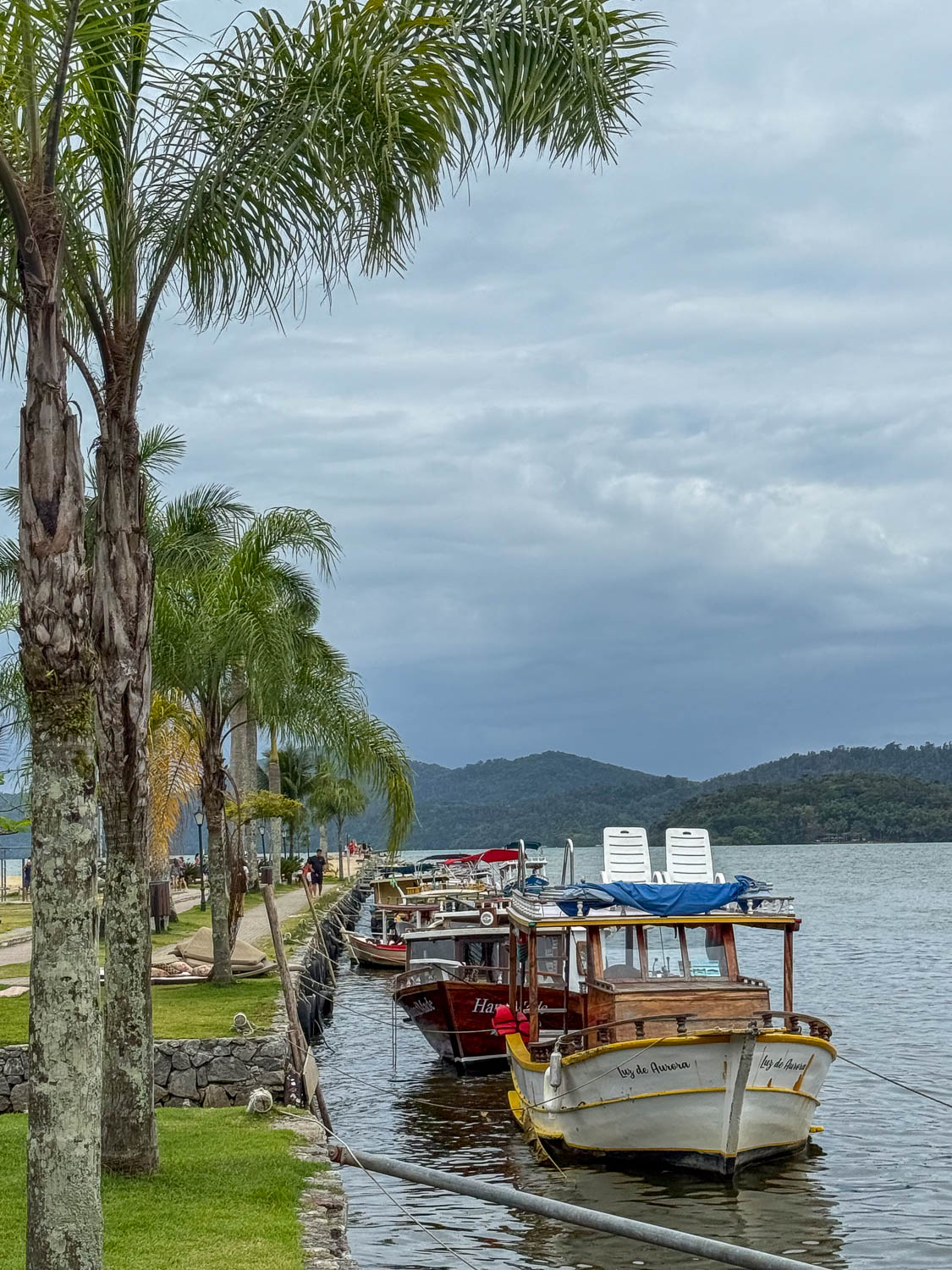 Boat arriving near the historic waterfront of Paraty Bay in Paraty, Brazil