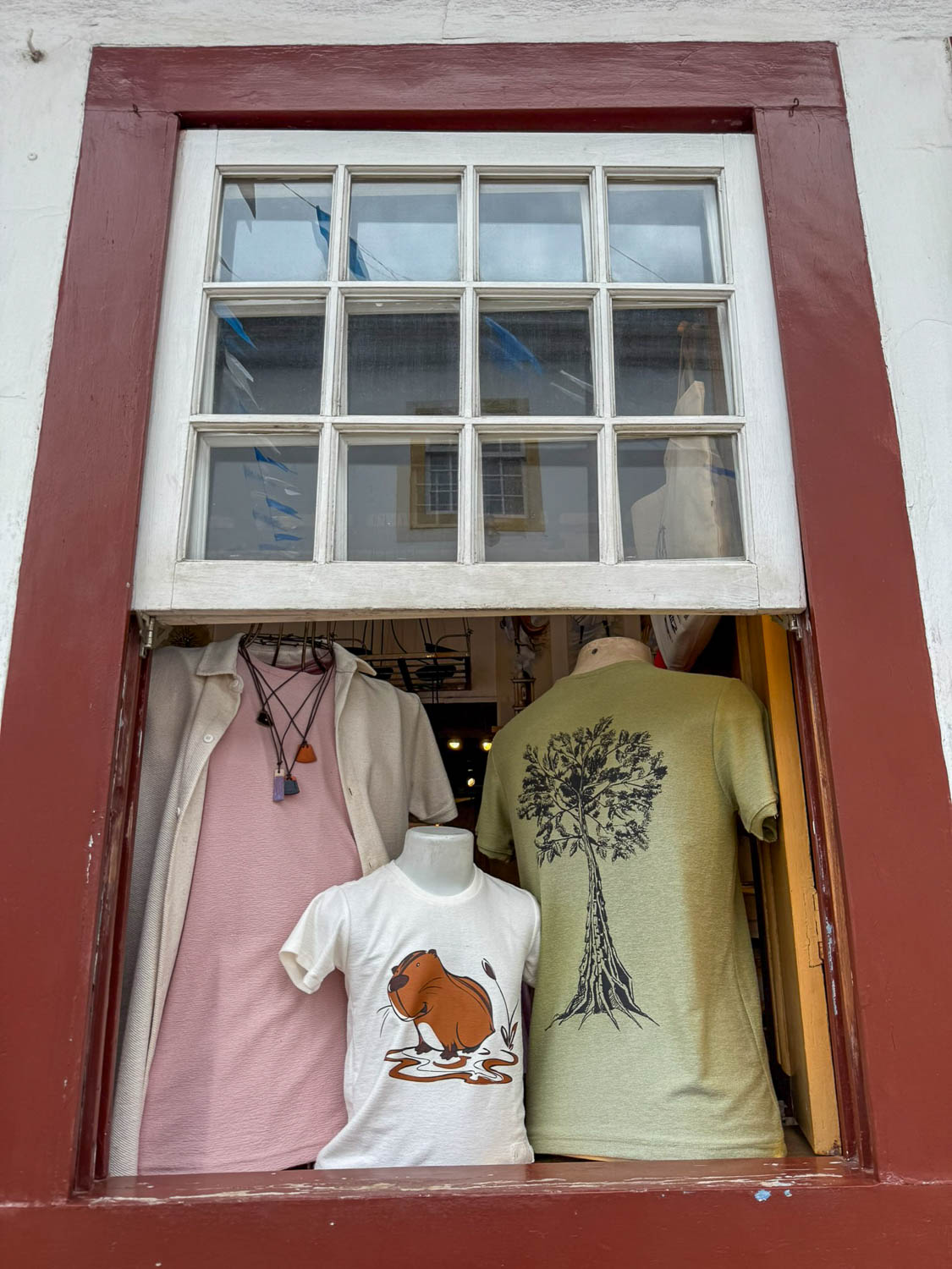 Unique clothing designs displayed in boutique shops in Paraty historic center