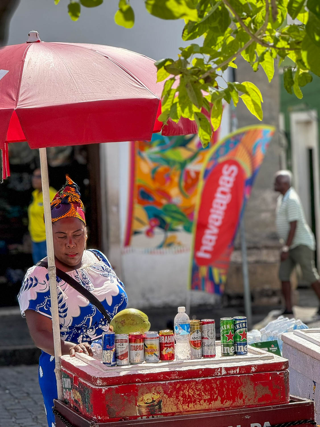 Brazil street vendor selling tropical drinks and juices in a busy outdoor setting