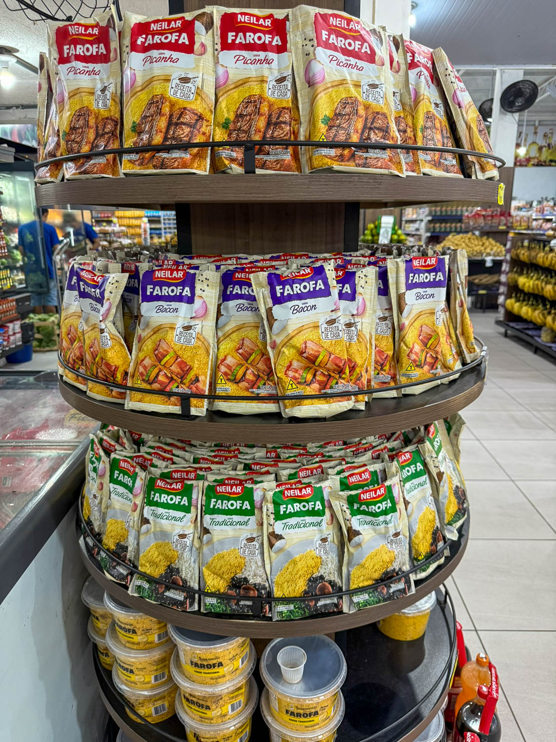 Traditional Brazilian Food: Iconic Dishes, Snacks, and Desserts 15 Packaged farofa in a Brazilian supermarket, a traditional cassava flour side dish