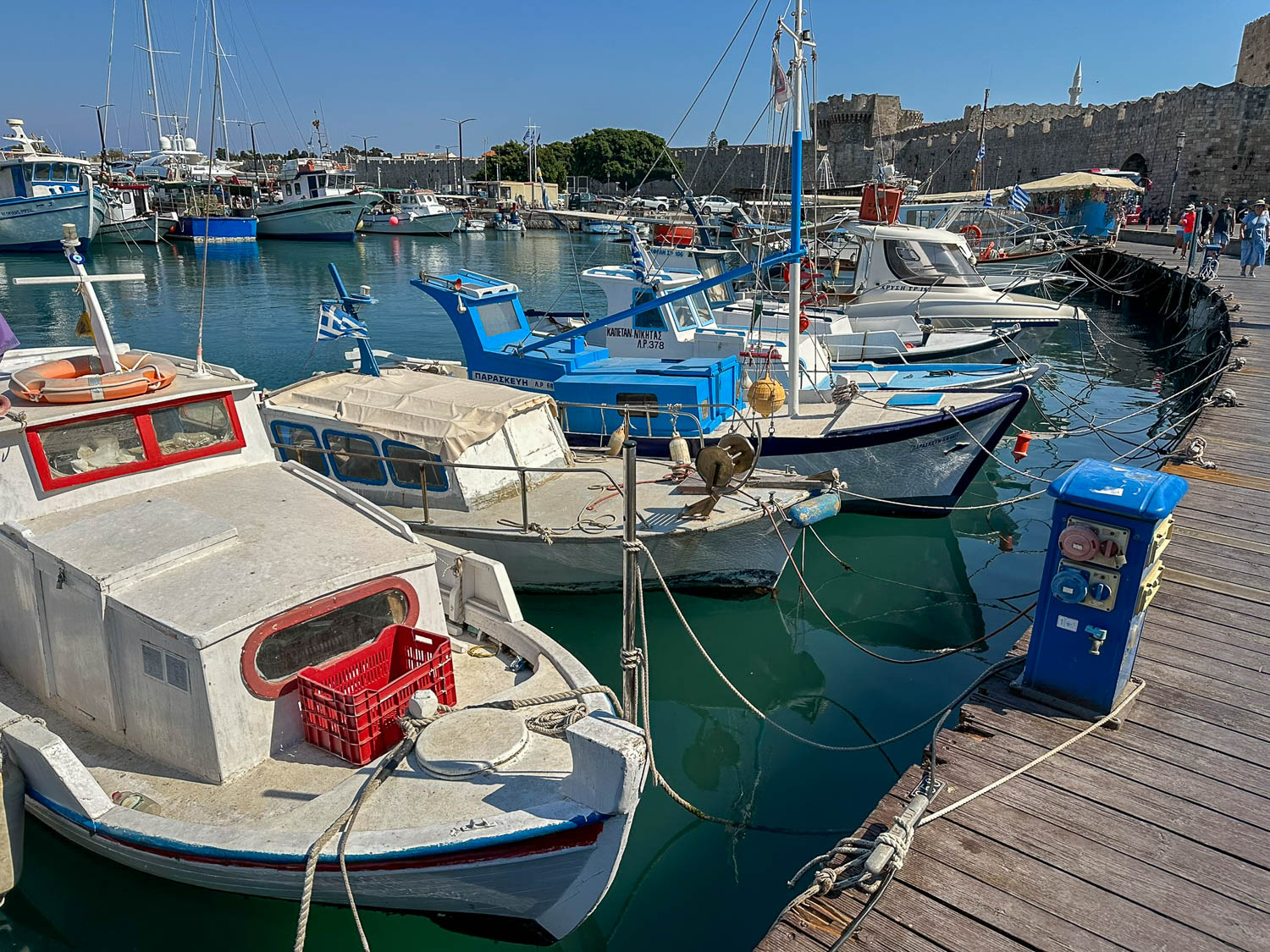 Old Town Rhodes, Greece: The Best Things To Do and See 24 Mandraki Harbor in Rhodes Greece believed site of the Colossus of Rhodes