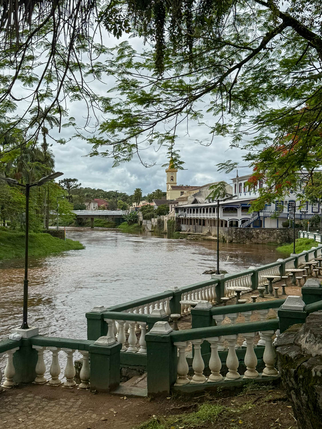 Scenic view of the Nhundiaquara River in Morretes, Paraná, surrounded by lush Atlantic Forest landscapes.