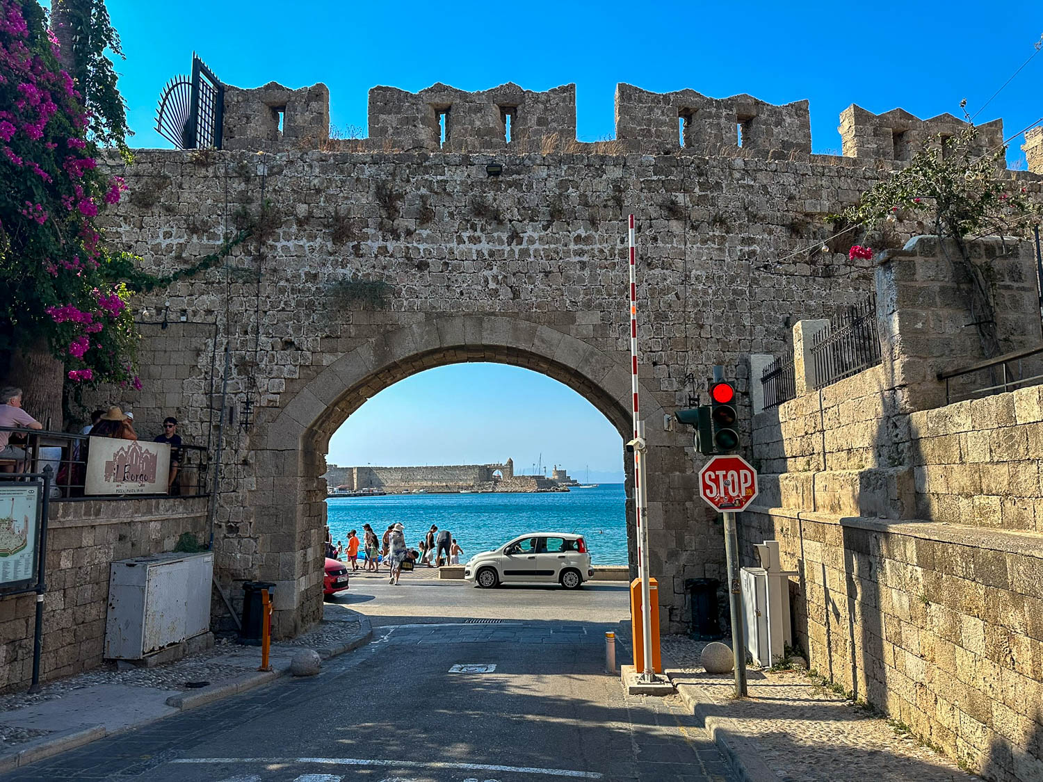 Old Town Rhodes, Greece: The Best Things To Do and See 12 Stone archway passage in Old Town Rhodes Greece connecting medieval streets