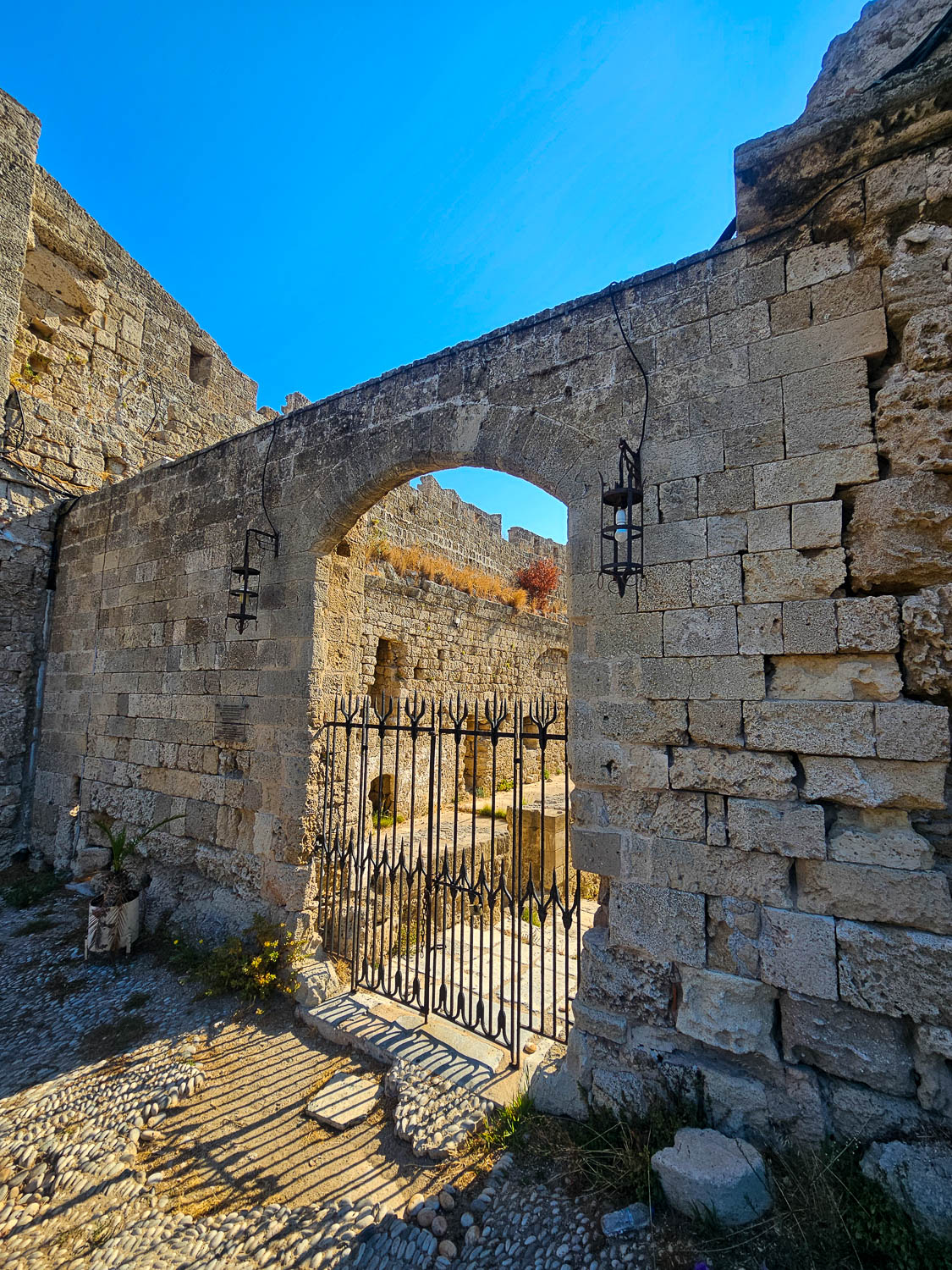 Old Town Rhodes, Greece: The Best Things To Do and See 13 Medieval walls of Old Town Rhodes Greece showing layered stone fortifications