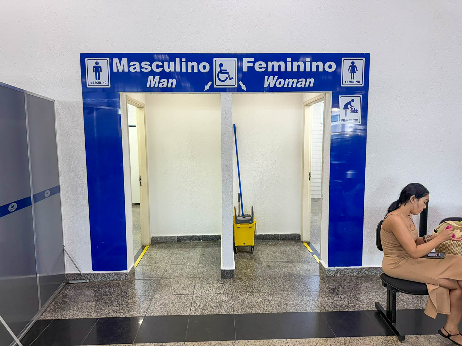 Interior of the Port of Santos cruise terminal showing seating, security, and passenger facilities before embarkation.