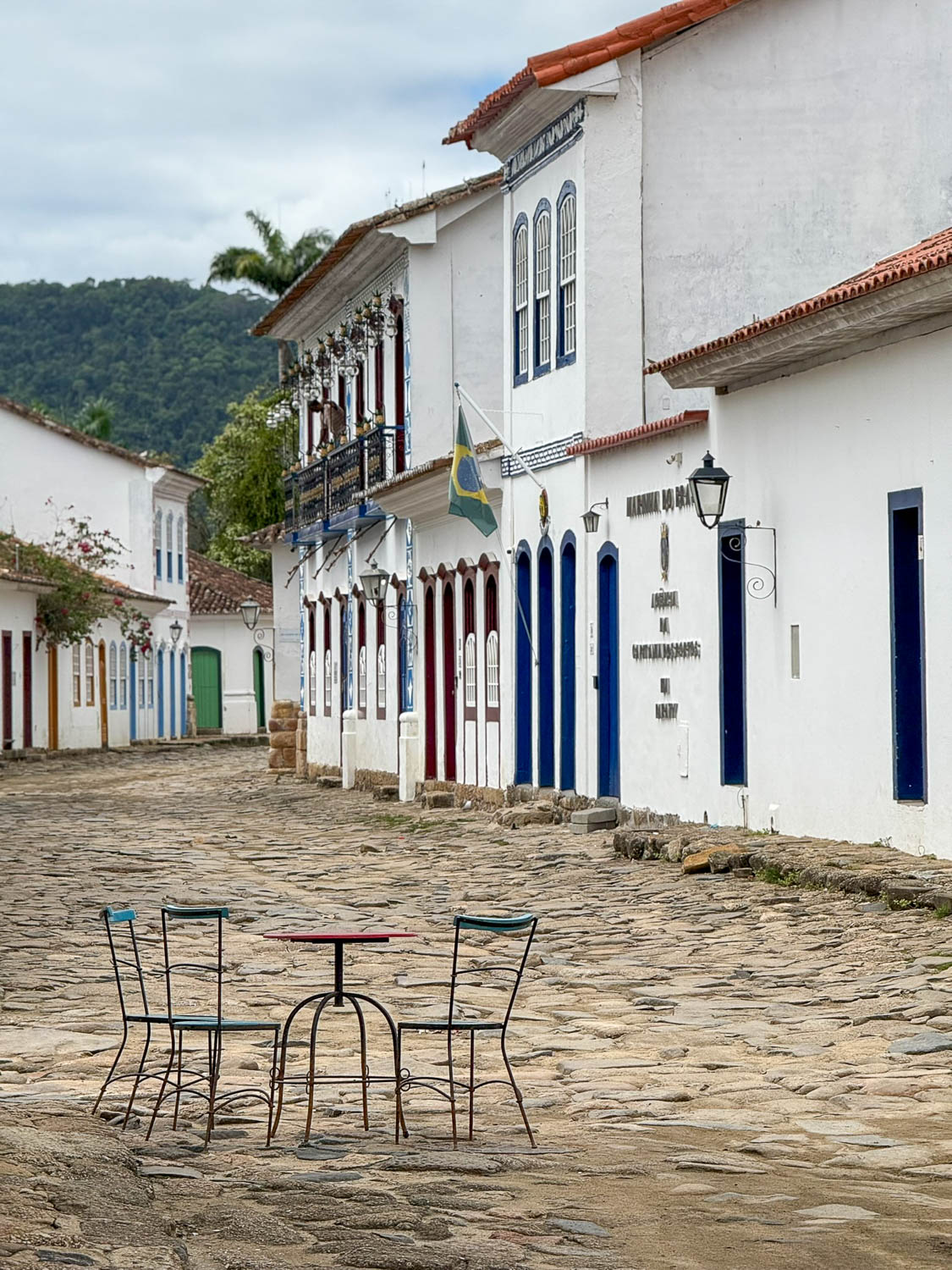 Peaceful cobblestone street lined with colonial buildings in Paraty historic center, Brazil