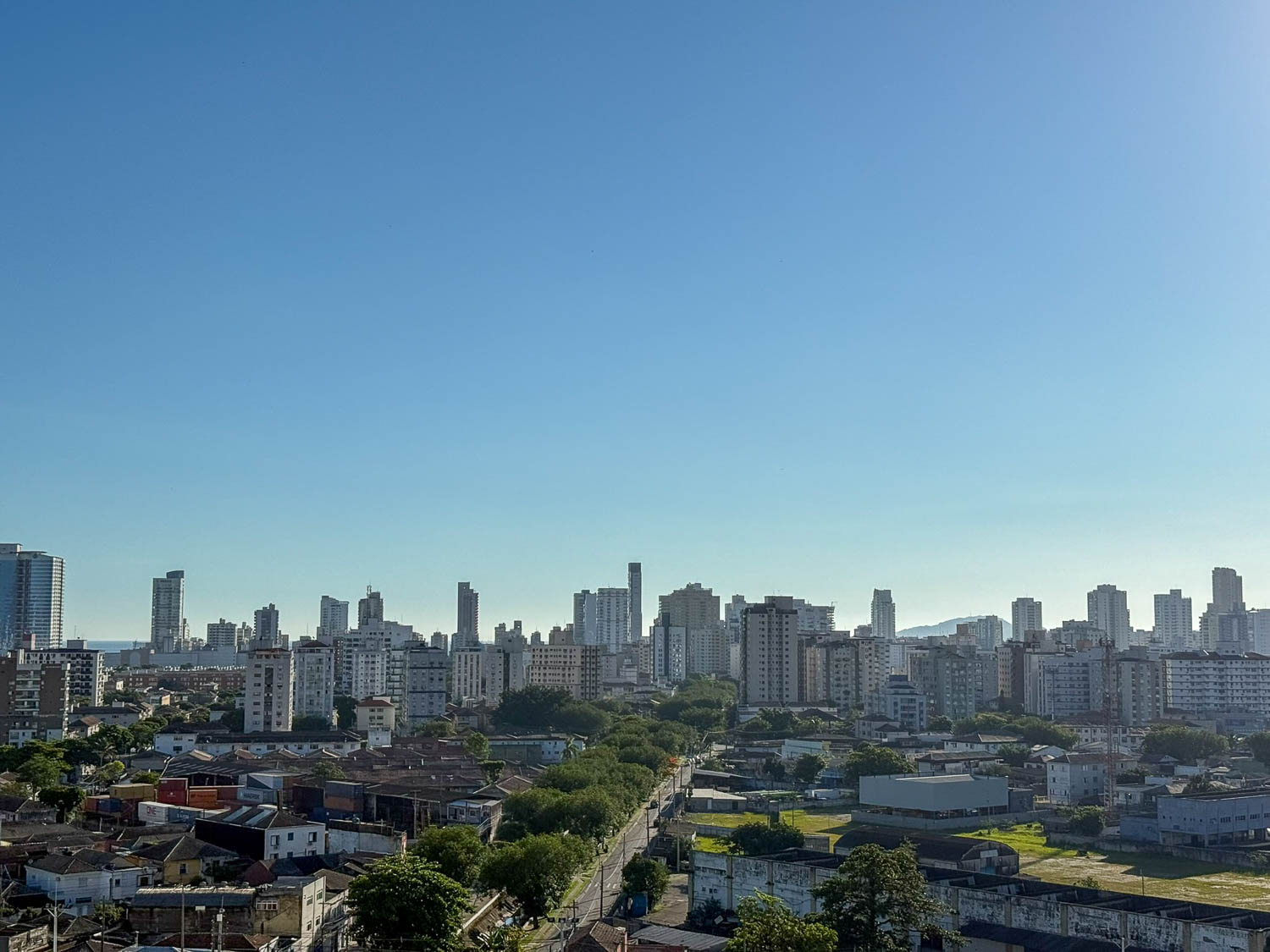 Skyline of Santos, Brazil, with beachfront high-rise buildings lining the Atlantic coastline.