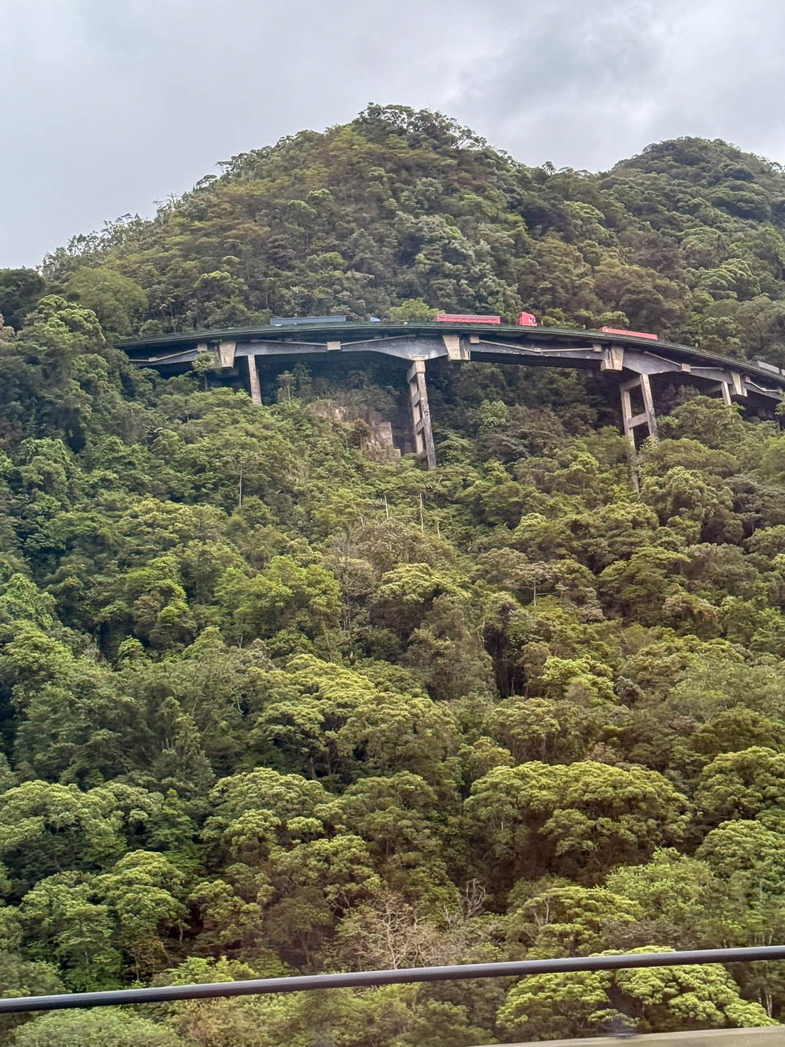 Lush green Serra do Mar mountains rising just outside Santos, Brazil, near the Port of Santos.