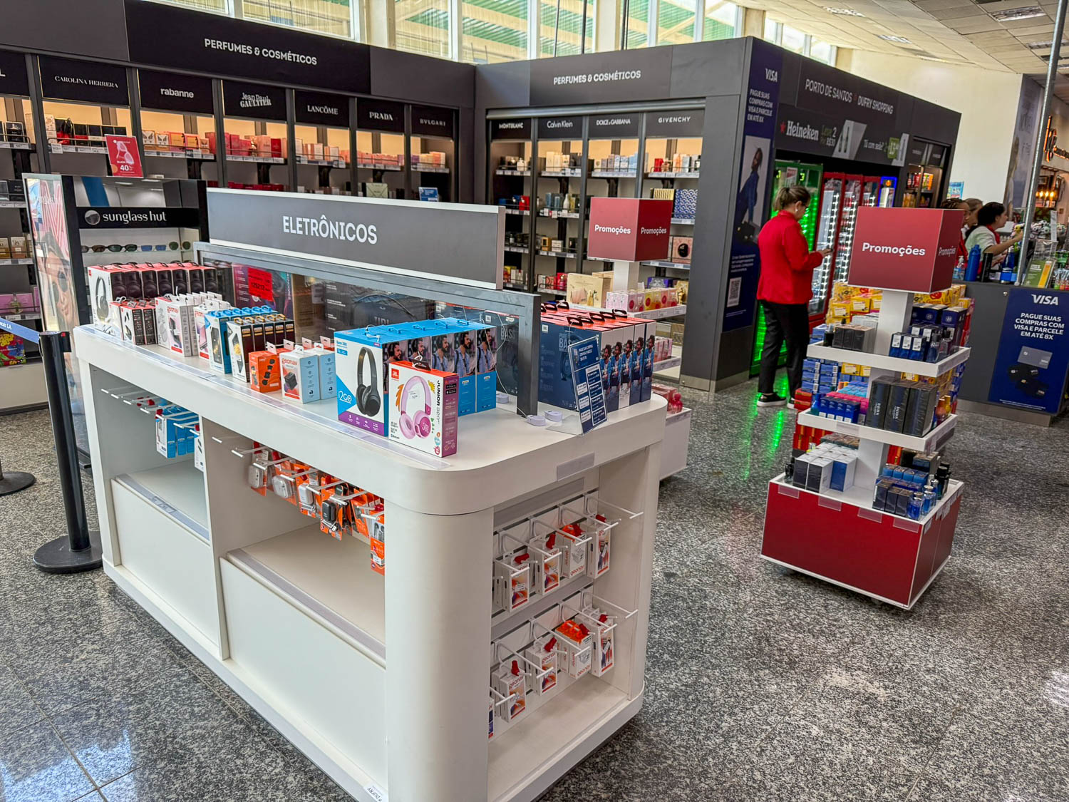Travel gadgets and electronics useful for a cruise visit to Santos, Brazil, displayed before going ashore.