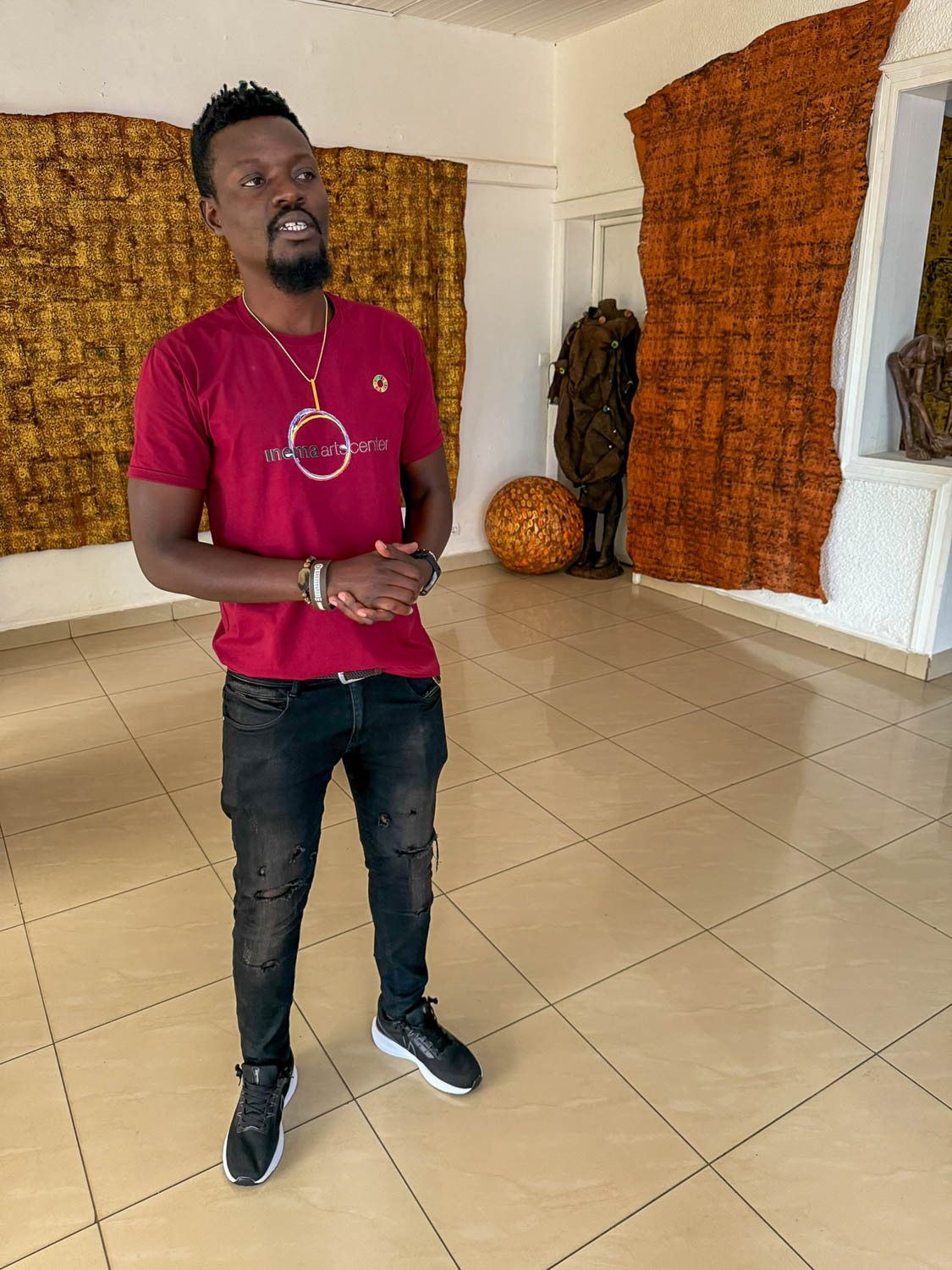 Local guide at Inema Arts Center in Kigali Rwanda highlighting contemporary African art and culture