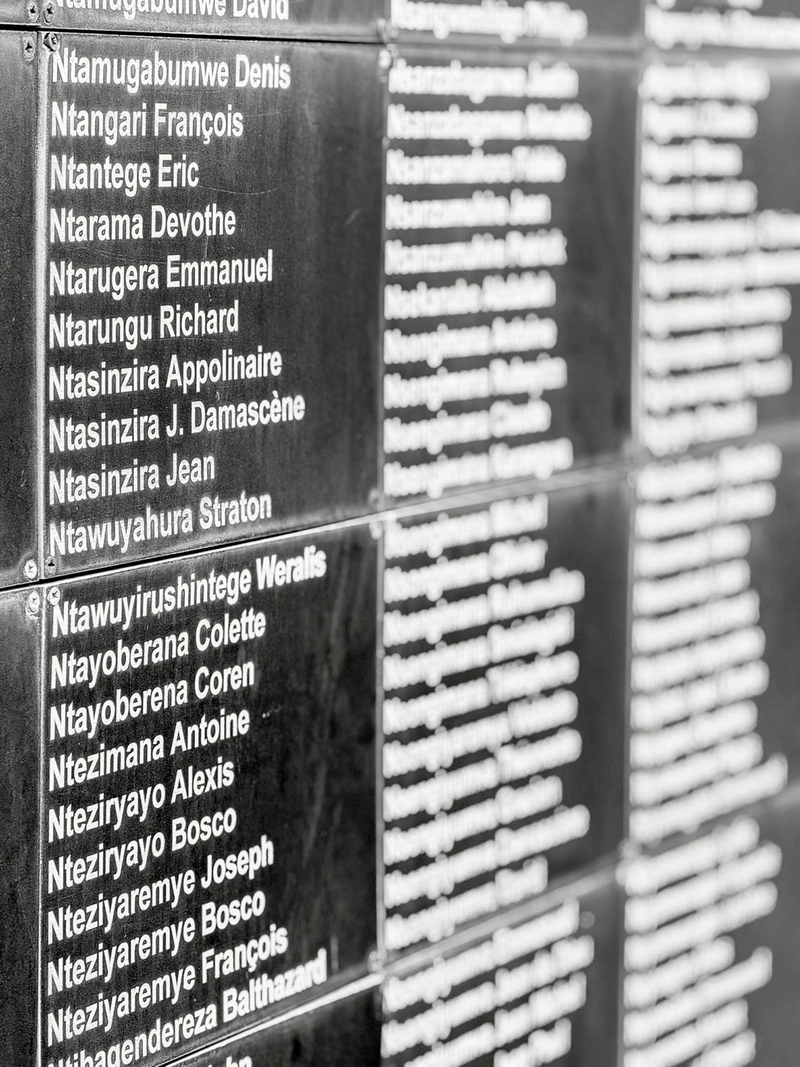 Names of genocide victims displayed at the Kigali Genocide Memorial in Rwanda, honoring lives lost in 1994