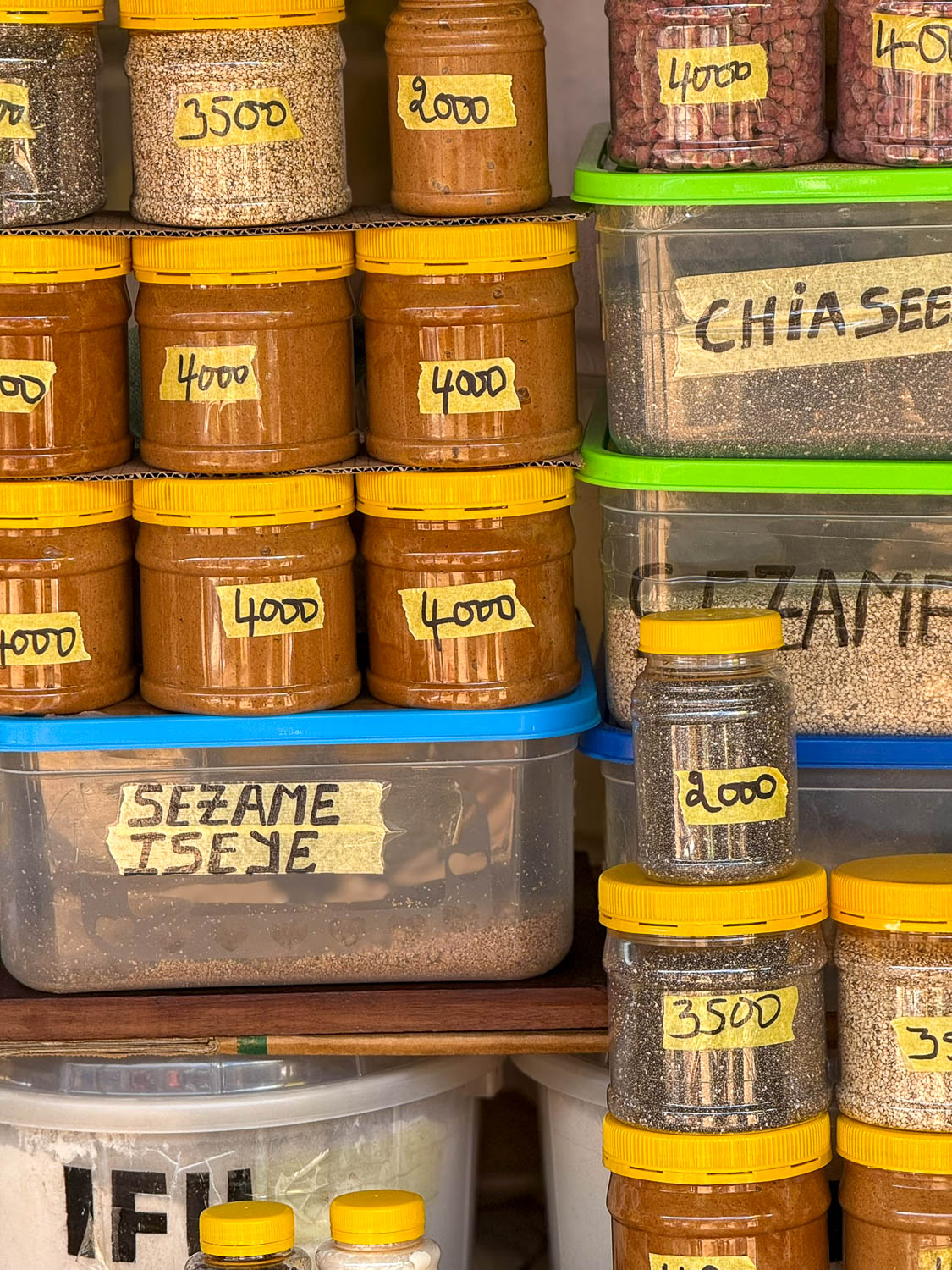 Colorful spices, seeds, and nuts at Kimironko Market in Kigali Rwanda