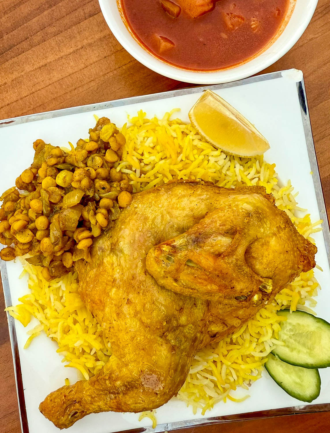 Traditional machboos dish served during Ramadan at Souq Waqif in Doha Qatar highlighting local cuisine