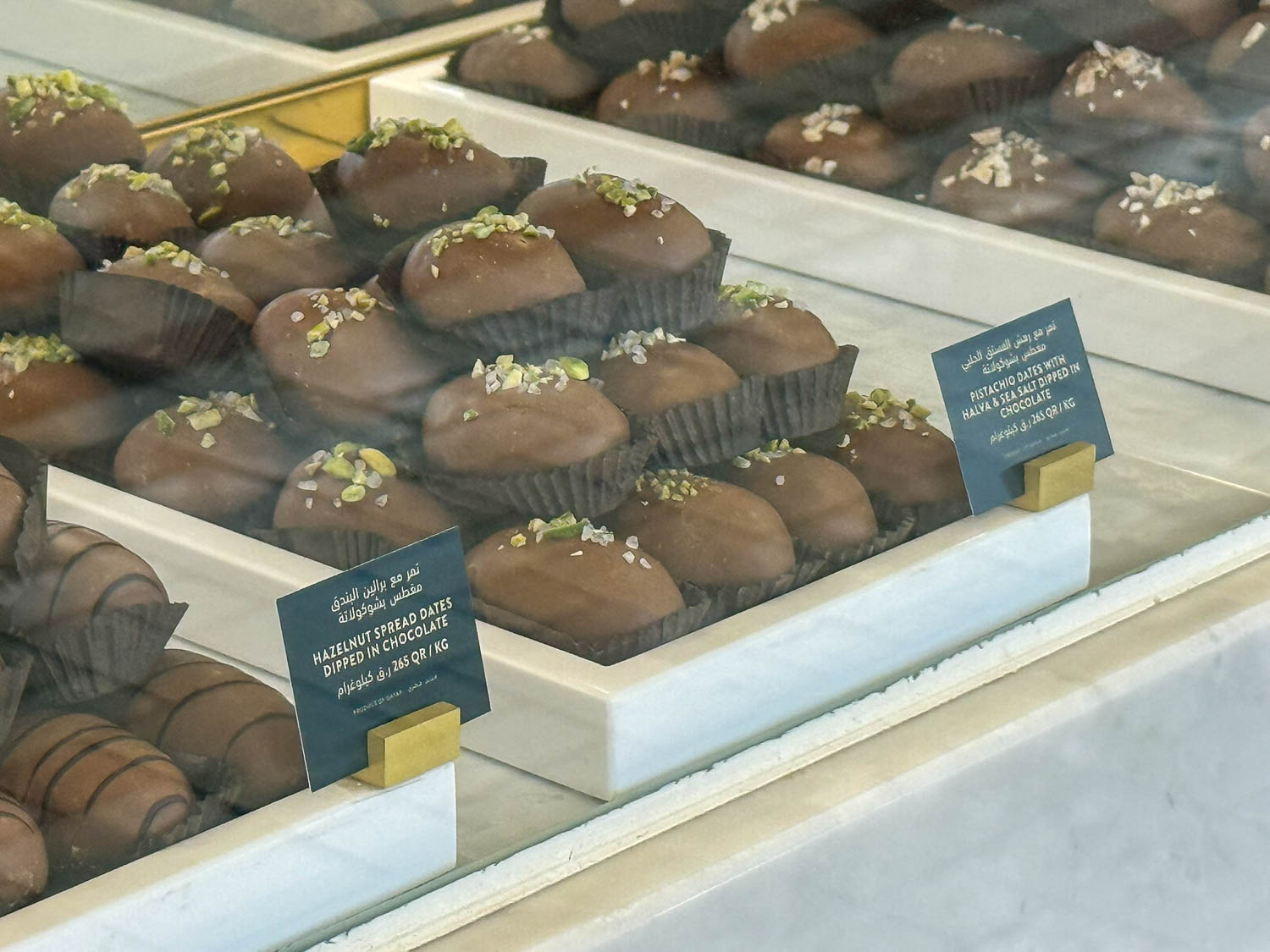Variety of date products including syrups and sweets at Souq Waqif festivals in Doha Qatar