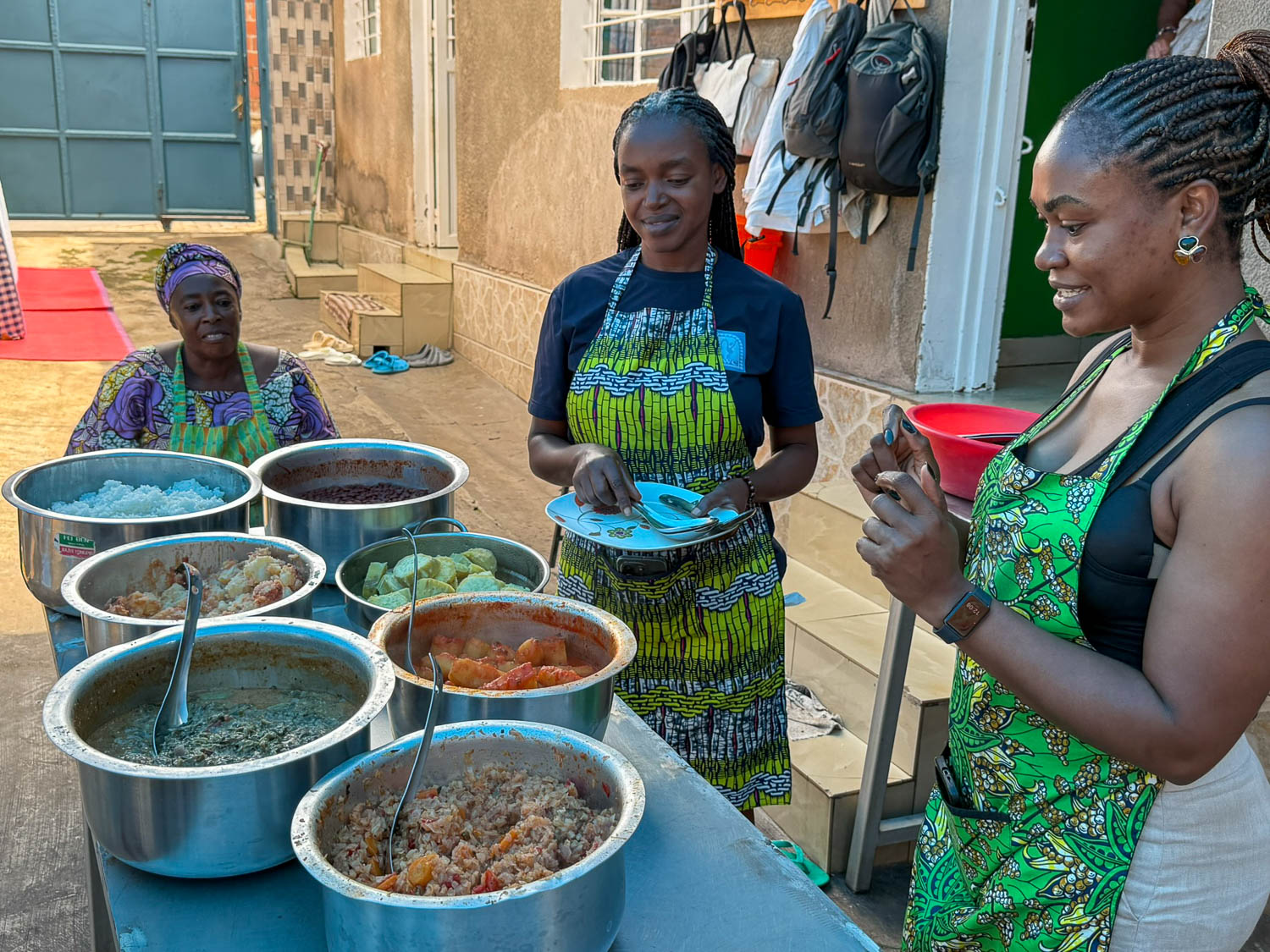 Family-style Rwandan cuisine meal with shared dishes at Nyamirambo Women’s Center in Kigali