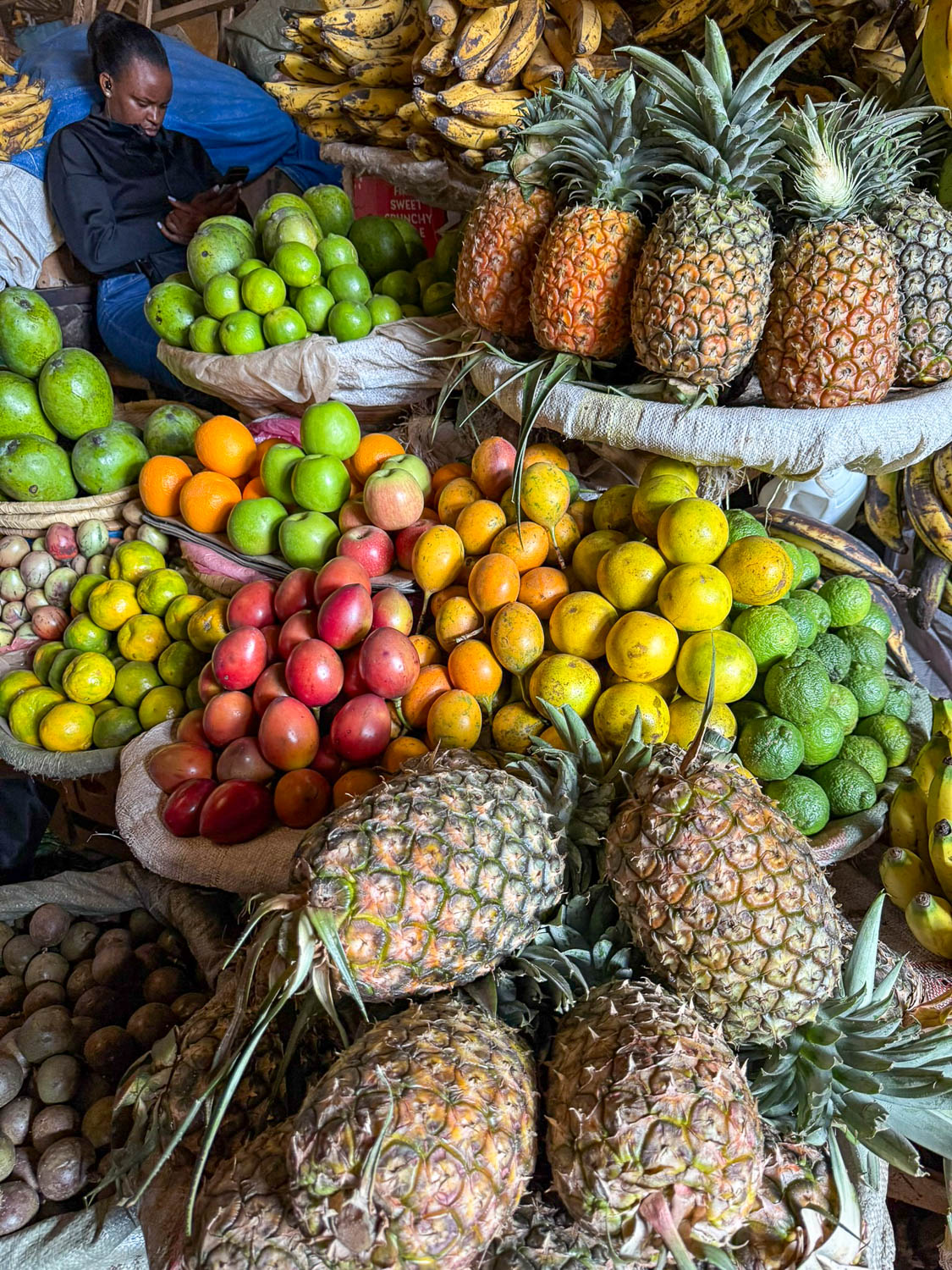 Locally grown fruits at Kimironko Market in Kigali used in Rwandan cuisine