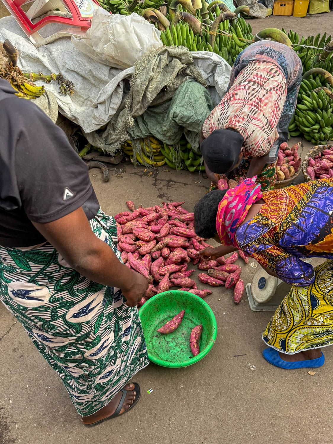 Fresh vegetables being prepared for sale at Gisenyi Market supporting Rwandan cuisine