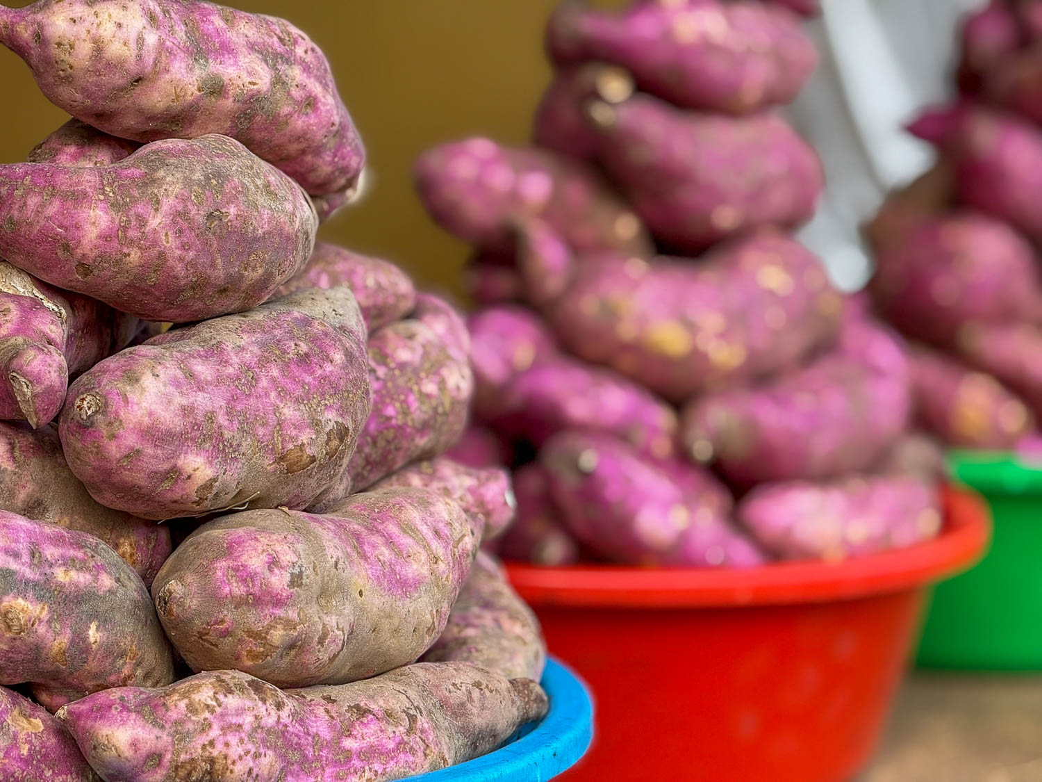Sweet potatoes at Kinyanda Market, a staple ingredient in Rwandan cuisine