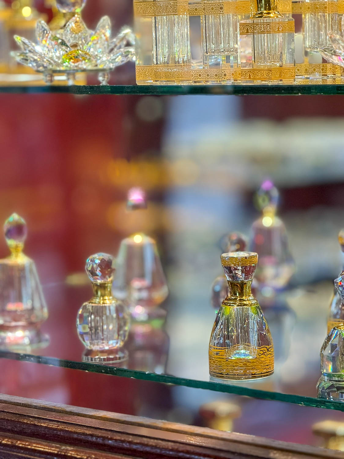 Traditional perfume bottles with oud and oils for sale at Souq Waqif Doha Qatar