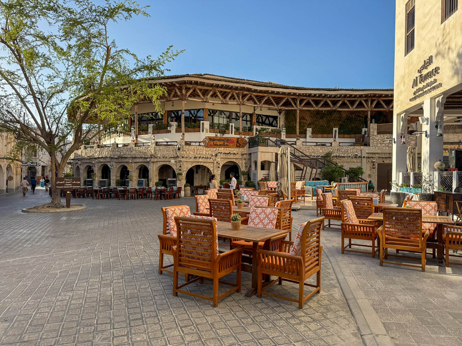 Cafes and restaurants at Souq Waqif Doha Qatar preparing for evening crowds