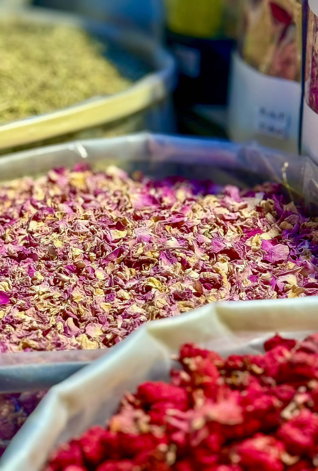 Colorful spice stalls at Souq Waqif in Doha Qatar featuring vibrant mounds of spices and traditional marketplace displays