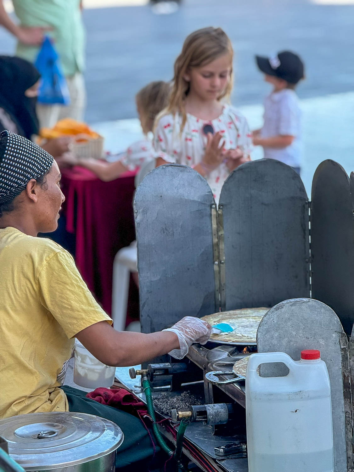 Street food vendors at Souq Waqif Doha Qatar offering traditional Middle Eastern dishes