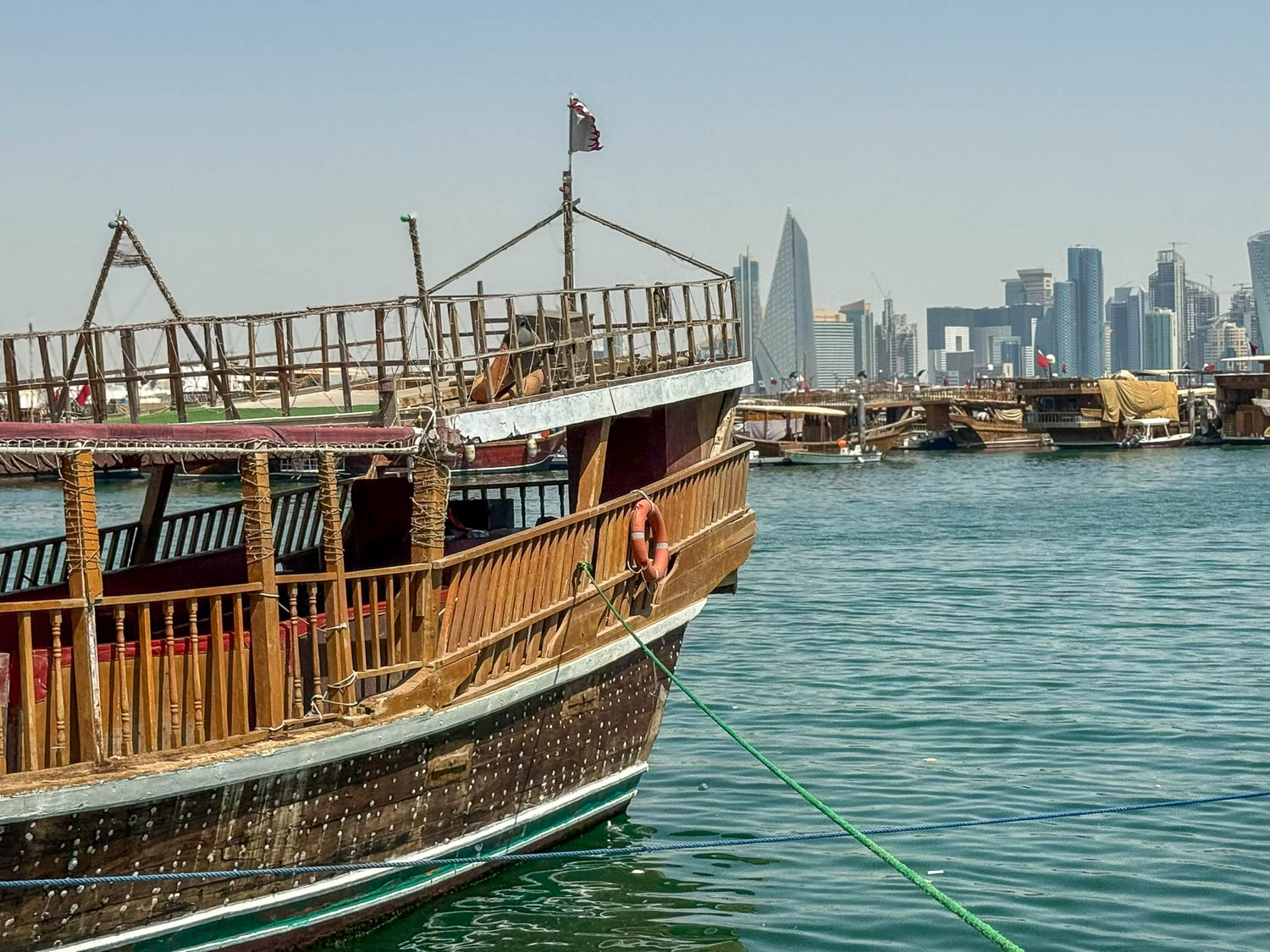 Traditional dhow boats docked at Dhow Harbour in Doha Qatar