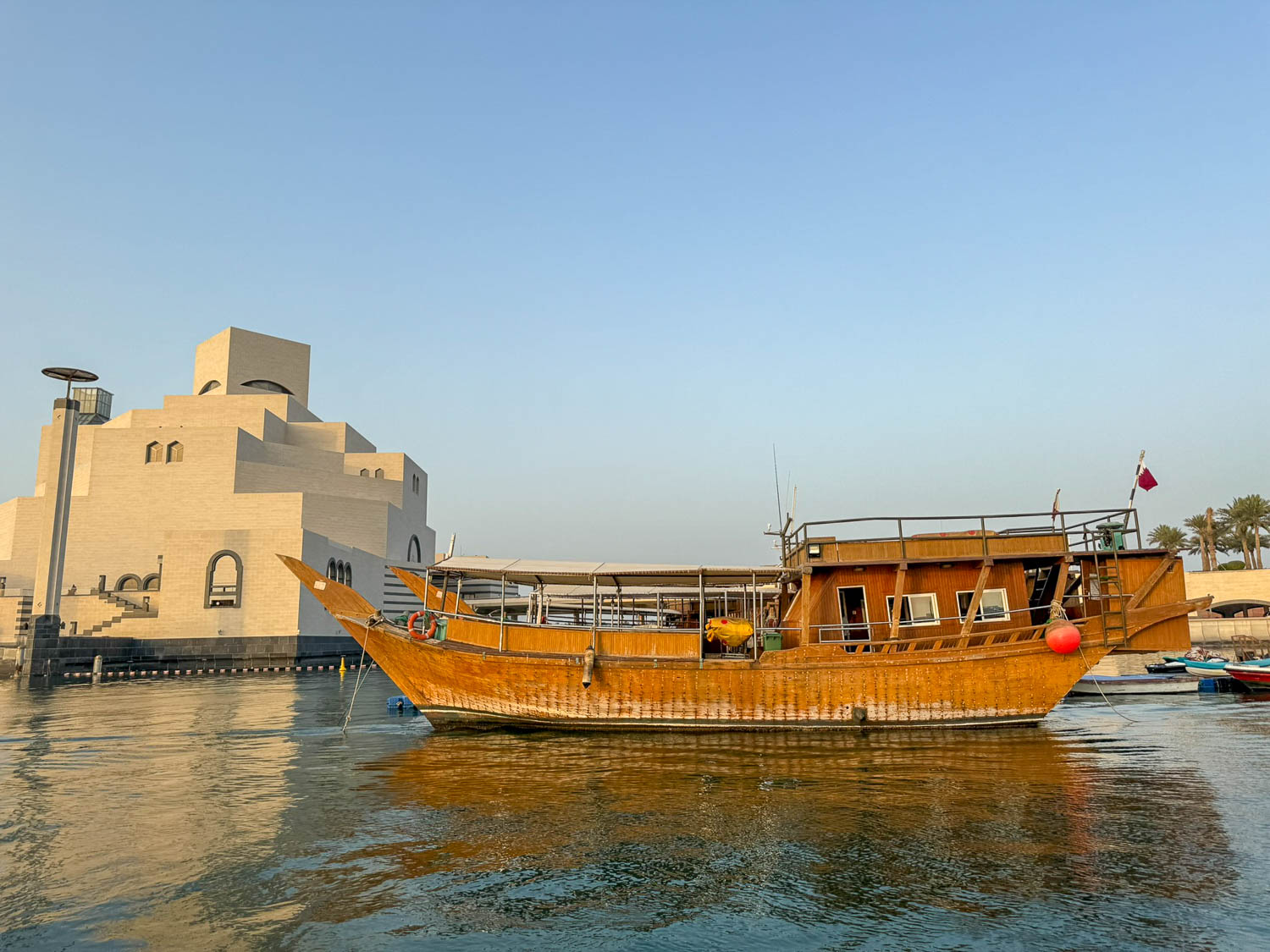 Traditional wooden dhows near the Museum of Islamic Art in Doha Qatar