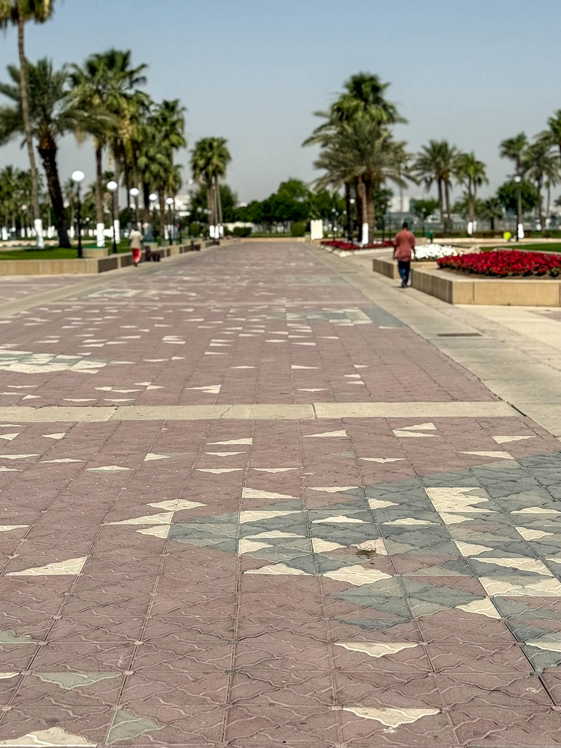 Wide pedestrian walkways and open public spaces along the Doha Corniche in Qatar