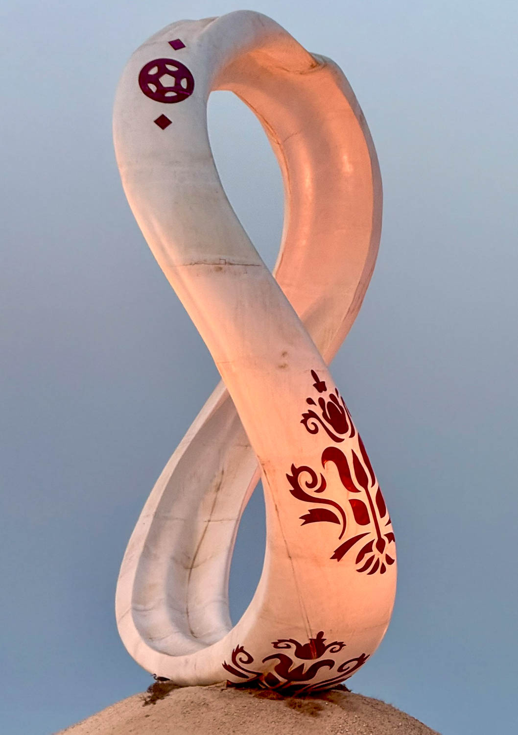 FIFA World Cup 2022 statue viewed from a dhow cruise in Doha Bay Qatar
