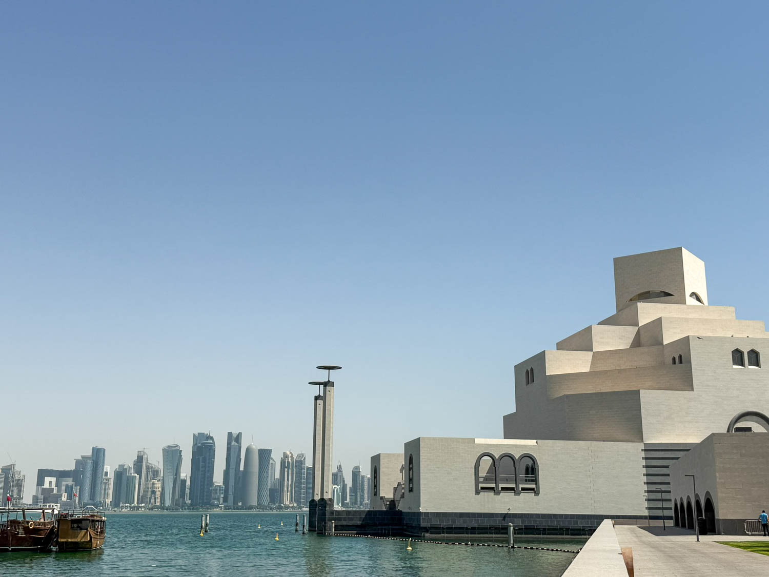 The Museum of Islamic Art with the modern West Bay skyline behind it in Doha Qatar